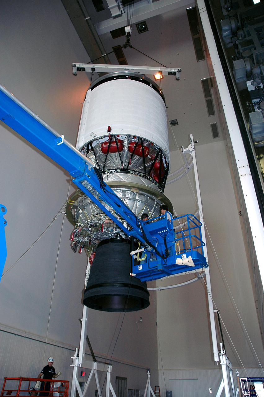 KENNEDY SPACE CENTER, FLA. - At the Delta Operations Center in Cape Canaveral, Fla., the Boeing Delta IV second stage is lifted by an overhead crane. The element is being moved to a transporter for transfer to the Horizontal Integration Facility for further processing. The Delta IV is the launch vehicle for the GOES-N satellite. Geostationary Operational Environmental Satellites (GOES) are sponsored by the National Aeronautics and Space Administration (NASA) and the National Oceanic and Atmospheric Administration (NOAA). GOES-N is the first in the next series of GOES satellites, N-P. The multi-mission GOES series N-P will be a vital contributor to weather, solar and space operations and science. The GOES N-P series will aid activities ranging from severe storm warnings to resource management and advances in science. GOES-N is scheduled to launch May 4 from Cape Canaveral Air Force Station, Fla.