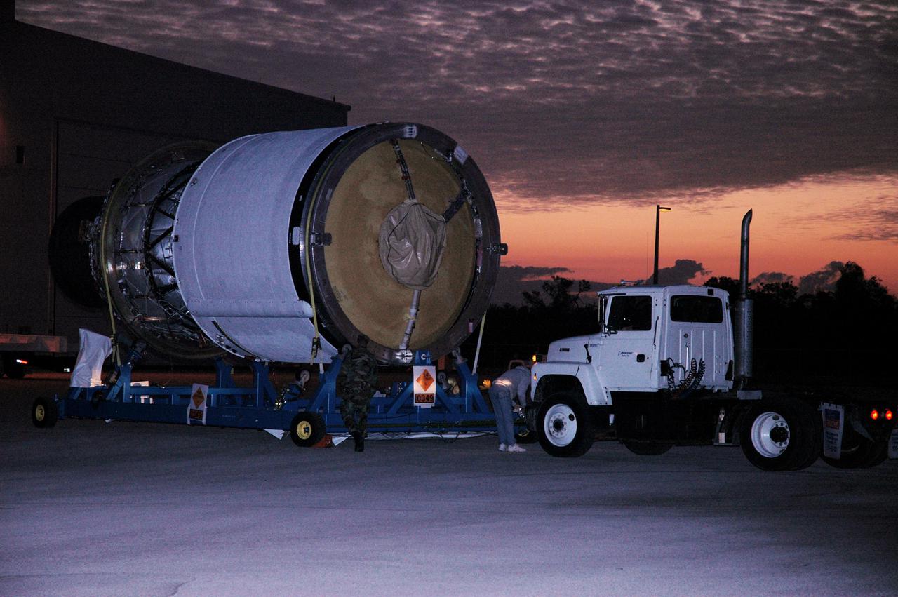 KENNEDY SPACE CENTER, FLA. - As dawn breaks, the Boeing Delta IV second stage arrives at the Horizontal Integration Facility (HIF) for further processing. It was moved from the Delta Operations Center in Cape Canaveral, Fla. The Delta IV is the launch vehicle for the GOES-N satellite. Geostationary Operational Environmental Satellites (GOES) are sponsored by the National Aeronautics and Space Administration (NASA) and the National Oceanic and Atmospheric Administration (NOAA). GOES-N is the first in the next series of GOES satellites, N-P. The multi-mission GOES series N-P will be a vital contributor to weather, solar and space operations and science. The GOES N-P series will aid activities ranging from severe storm warnings to resource management and advances in science. GOES-N is scheduled to launch May 4 from Cape Canaveral Air Force Station, Fla.