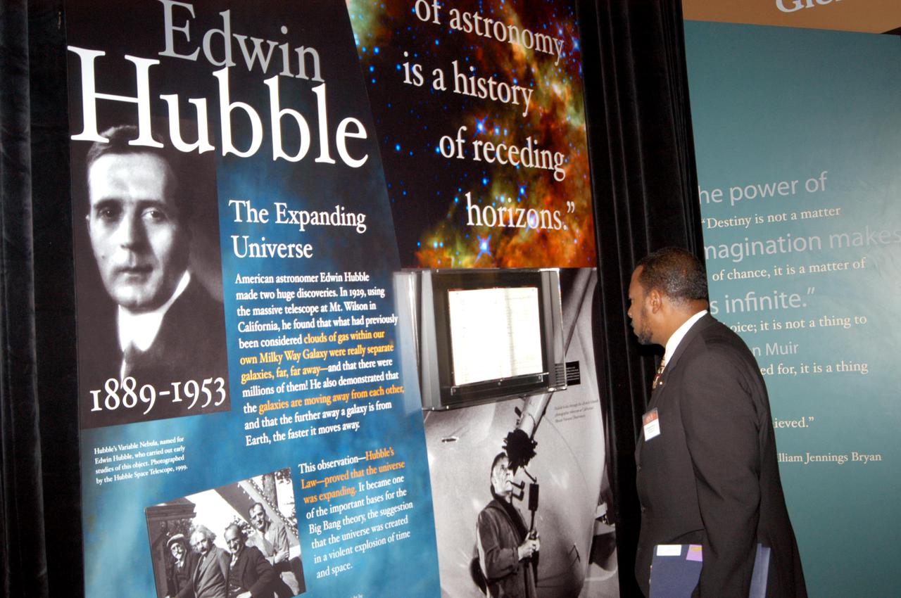 KENNEDY SPACE CENTER, FLA. - Dr. Woodrow Whitlow Jr., deputy director of Kennedy Space Center, looks at an exhibit of astronomer Edwin Hubble at the Museum of Science and Industry (MOSI) in Tampa. Whitlow was at MOSI to view the space exhibits Space: A Journey to Our Future, an extraordinary, interactive exhibition designed to entertain, educate and inspire; and SPACE STATION, the first cinematic journey to the International Space Station (ISS), where audiences can experience for themselves life in zero gravity aboard the new station.