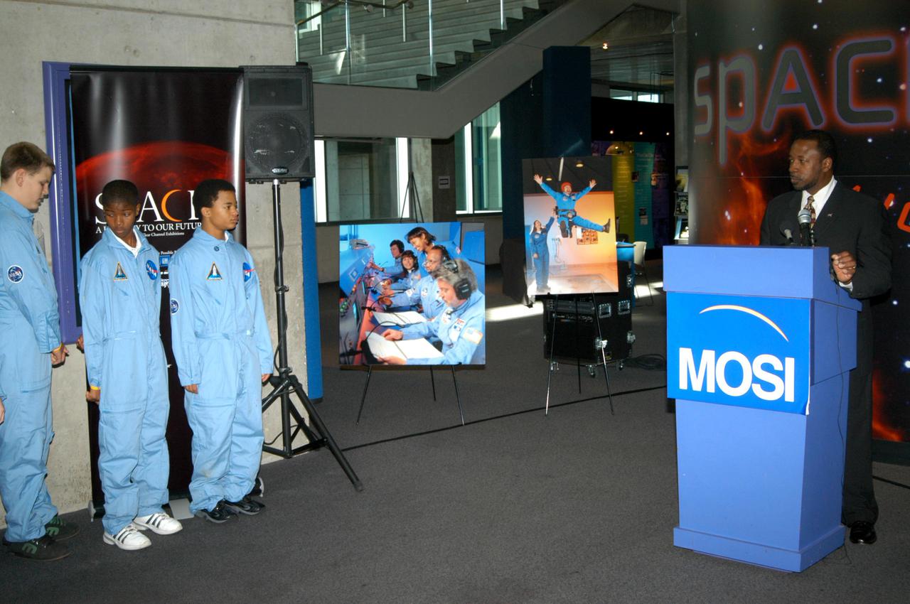 KENNEDY SPACE CENTER, FLA. - At the Museum of Science and Industry (MOSI) in Tampa, KSC Deputy Director Dr. Woodrow Whitlow Jr. introduces students from one of NASA’s Explorer Schools, Stewart Middle School in Tampa. The students and Dr. Whitlow are at MOSI to view the space exhibits Space: A Journey to Our Future, an extraordinary, interactive exhibition designed to entertain, educate and inspire; and SPACE STATION, the first cinematic journey to the International Space Station (ISS), where audiences can experience for themselves life in zero gravity aboard the new station.