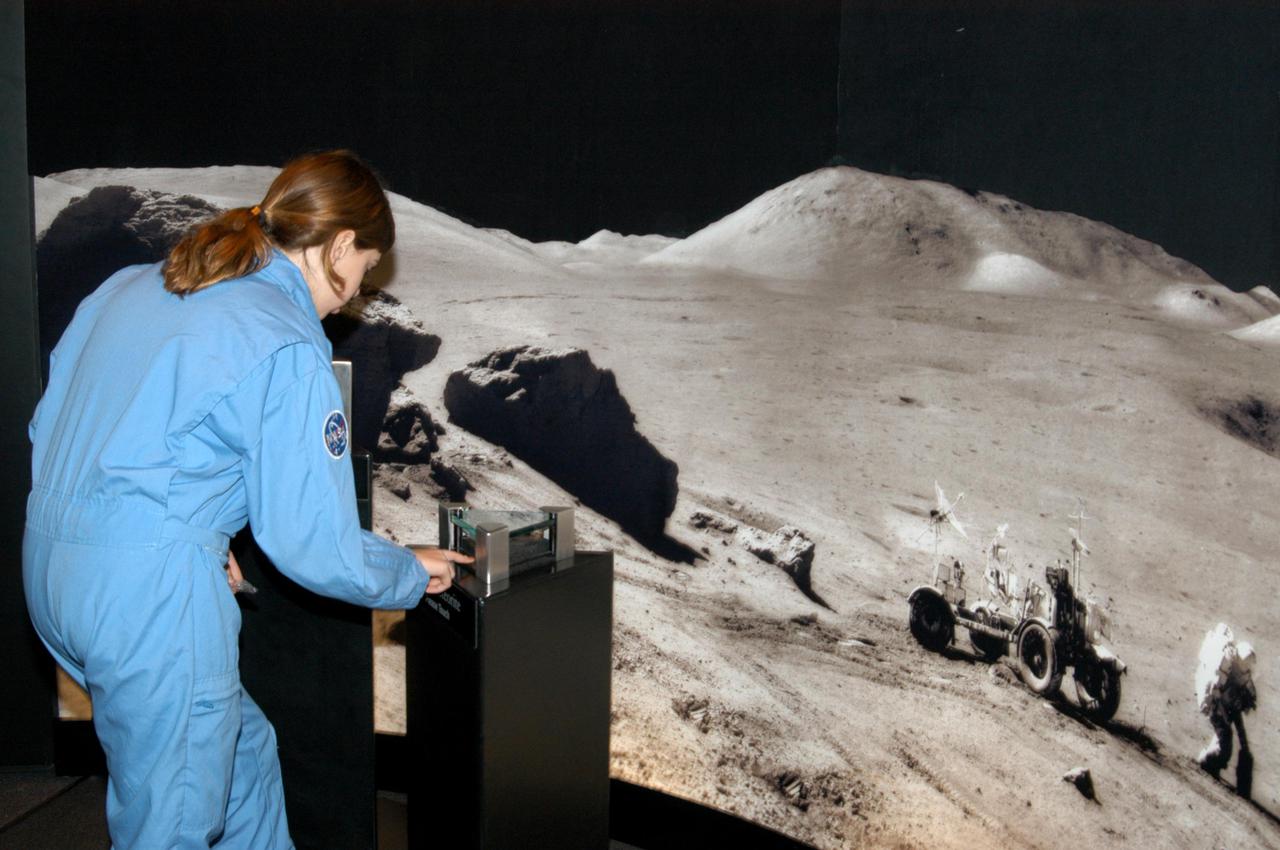 KENNEDY SPACE CENTER, FLA. - At the Museum of Science and Industry (MOSI) in Tampa, a student from one of NASA’s Explorer Schools, Stewart Middle School in Tampa, tries her hand at an interactive exhibit. The students are at MOSI to view the space exhibit Space: A Journey to Our Future, an extraordinary, interactive exhibition designed to entertain, educate and inspire. Another exhibit is SPACE STATION, the first cinematic journey to the International Space Station (ISS), where audiences can experience for themselves life in zero gravity aboard the new station.