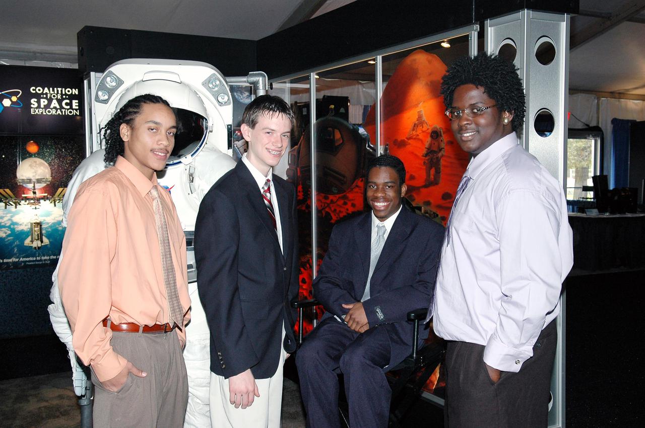 KENNEDY SPACE CENTER, FLA.  - At the “1st Space Exploration Conference: Continuing the Voyage of Discovery,”  held at Disney’s Contemporary Resort in Orlando, the winners of the Space Exploration Video Festival award sponsored by Lockheed Martin get together.  Second from left is Daniel Stearns, from East Longmeadow, Mass.  The others are the winning team from NASA Explorer School McNair High School in Dekalb County, Ga.  At left is Theo Maxie; at right are Daniel Jackson and Trenten Nash.  The three-day conference drew attendees from around the world.  It presented topics on new missions, technologies and infrastructure needed to turn the vision for space exploration into reality. Keynote speakers at the three-day conference include NASA Administrator Sean O'Keefe, Congressman Dave Weldon, film director James Cameron and NASA’s senior Mars scientist James Garvin.  The conference has drawn attendees from around the world.