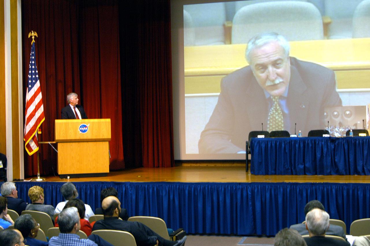 KENNEDY SPACE CENTER, FLA.  - During an All Hands Meeting, Center Director Jim Kennedy surprised attendees and viewers with a live uplink to NASA Administrator Sean O’Keefe (on screen).  The Administrator expressed his pride in and appreciation for Center employees and the work they do.  Most of the meeting dwelt on the 2006 NASA budget and its implications for the Center. NASA Administrator Sean O’Keefe presented on Tuesday the Administration's fiscal year 2006 budget proposal and its relevance to the Vision for Space Exploration.