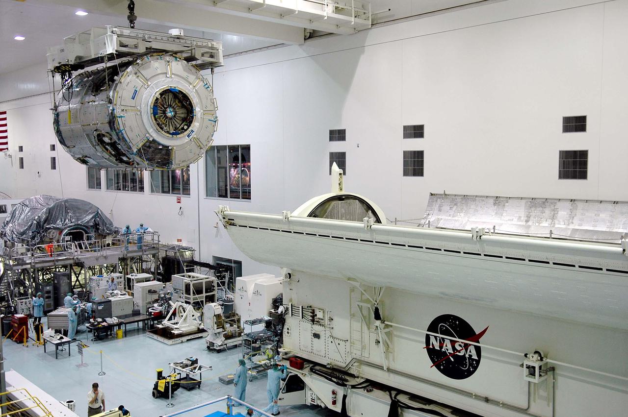KENNEDY SPACE CENTER, FLA.  - In the Space Station Processing Facility, the International Space Station module Node 2 moves toward a payload canister at right.  The module is being moved to the canister for transfer to the Operations and Checkout Building.  There it will undergo an element leak test. The installation of NASA's Node 2 will denote the U.S. Core Complete stage of International Space Station assembly and increase the living and working space inside the station to approximately 18,000 cubic feet. It also will allow the addition of international laboratories from Europe and Japan to the station.  Node 2 will provide a passageway between four station science experiment facilities: the U.S. Destiny Laboratory, the Kibo Japanese Experiment Module, the European Columbus Laboratory and the Centrifuge Accommodation Module. It also will provide connecting ports for Multi-Purpose Logistics Modules, the Japanese H II Transfer Vehicle and the Pressurized Mating Adapter 2 to which Space Shuttles dock. The Space Station Robotic Arm, Canadarm2, can operate from a powered grapple fixture on the exterior of Node 2.  It is scheduled for launch on shuttle mission STS-120, station assembly flight 10A.