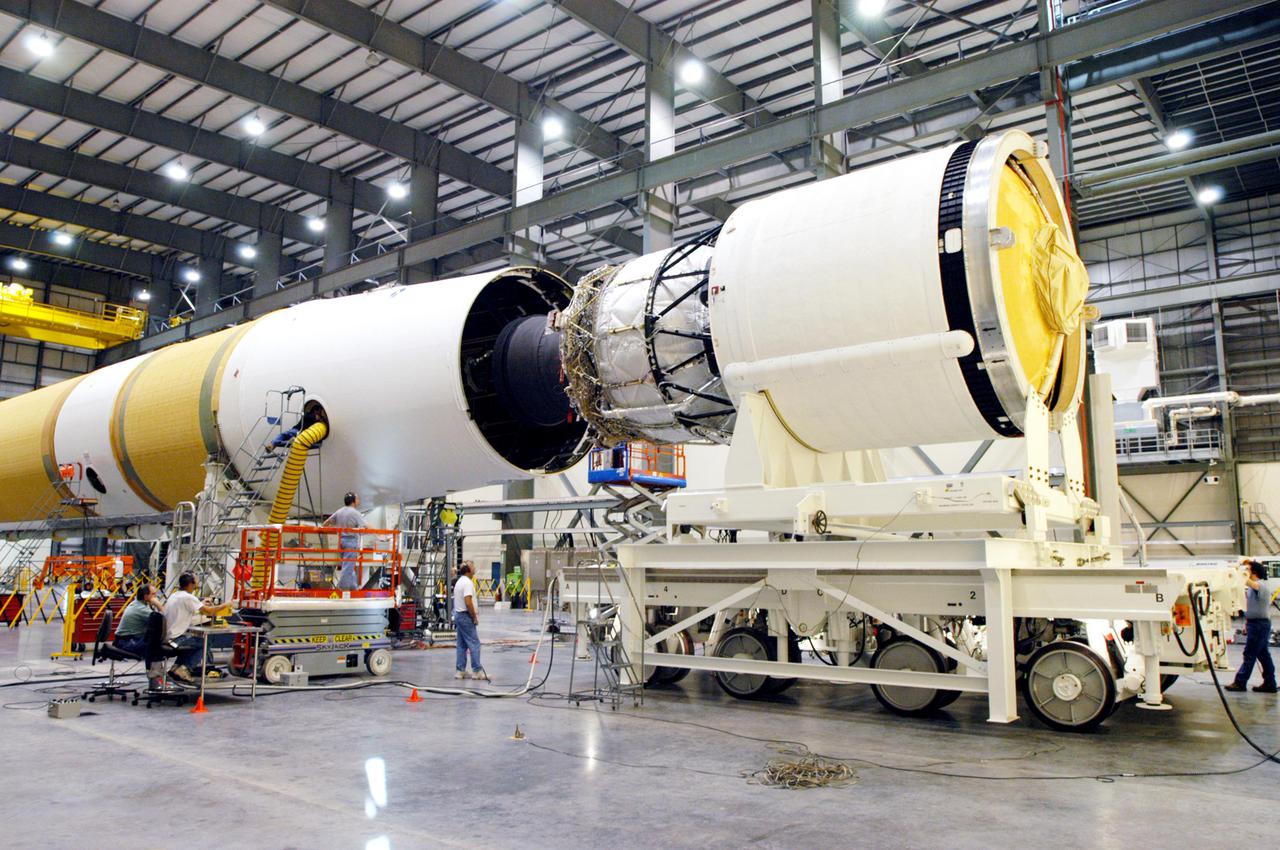 KENNEDY SPACE CENTER, FLA. - In the Horizontal Integration Facility, the GOES-N_Boeing Delta IV second stage (right) is being mated to the first stage. The Boeing Delta IV rocket will be used for the 2005 launching of the GOES-N weather satellite for NASA and NOAA (National Oceanic and Atmospheric Administration). The first in a series of three advanced weather satellites that include GOES-O and GOES-P, the GOES-N will provide continuous monitoring necessary for intensive data analysis. It will provide a constant vigil for the atmospheric “triggers” of severe weather conditions such as tornadoes, flash floods, hail storms and hurricanes. When these conditions develop, GOES-N will be able to monitor storm development and track their movements. Launch of GOES-N is scheduled for May 4 from Cape Canaveral Air Force Station.