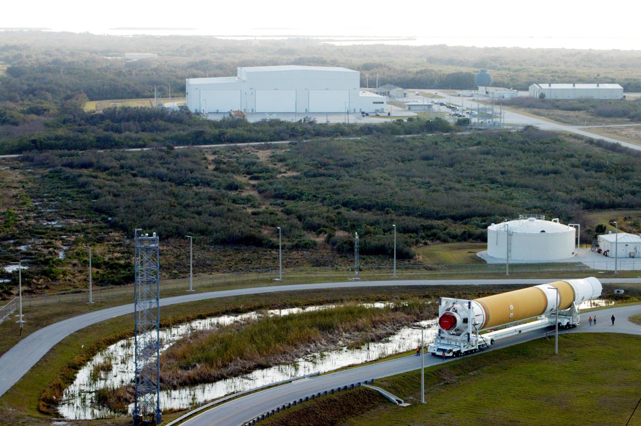 KENNEDY SPACE CENTER, FLA. - The first and second stages of the Boeing Delta IV rocket head for Launch Pad 37-B at Cape Canaveral Air Force Station after leaving the Horizontal Integration Facility, where the two stages were mated. The Delta IV is scheduled to launch the GOES-N satellite May 4. The satellite is the first of three for the National Oceanic and Atmospheric Administration that will provide continuous monitoring necessary for intensive data analysis. GOES-N will provide a constant vigil for the atmospheric “triggers” of severe weather conditions such as tornadoes, flash floods, hail storms and hurricanes. When these conditions develop, GOES-N will be able to monitor storm development and track their movements. NASA’s Goddard Space Flight Center is responsible for development of the satellite and testing of the spacecraft and its instruments.