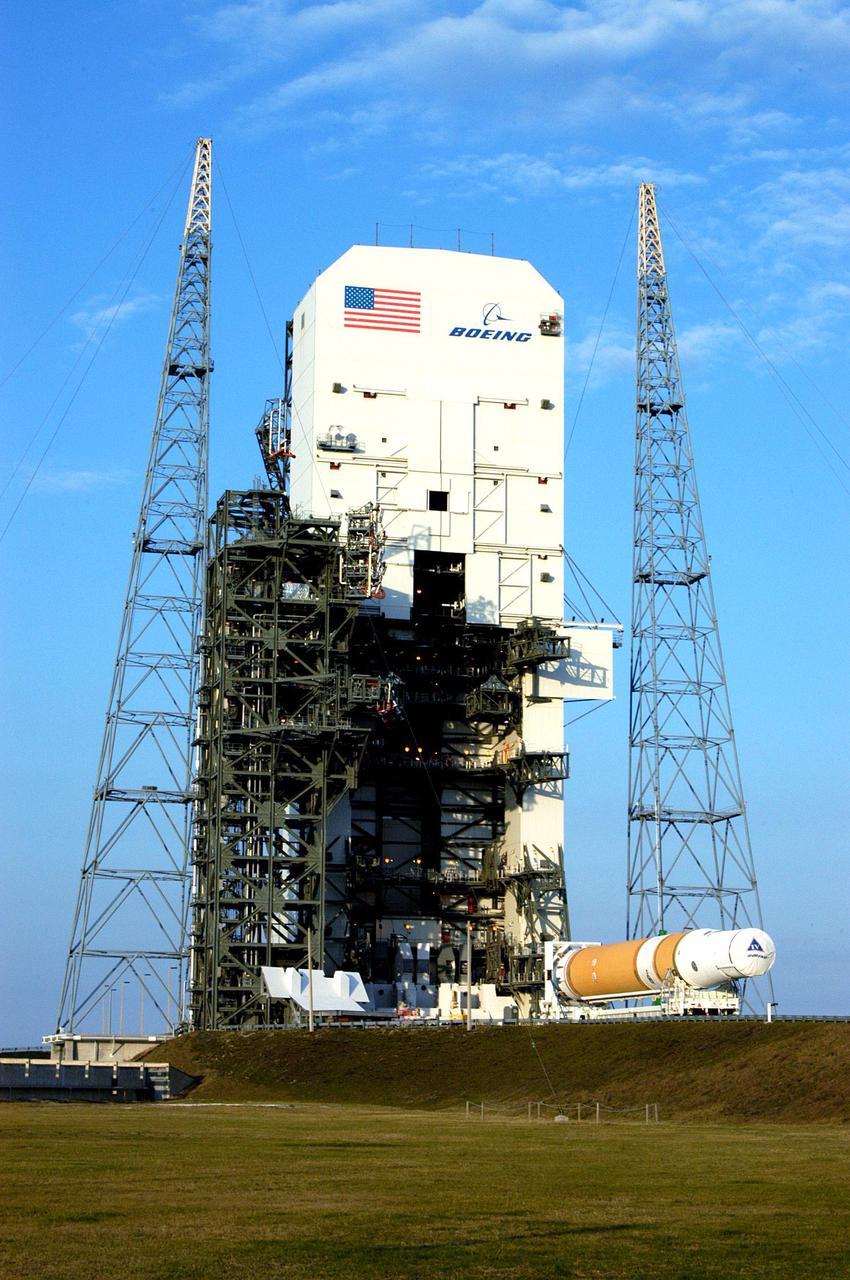 KENNEDY SPACE CENTER, FLA. - The first and second stages of the Boeing Delta IV rocket arrive at Launch Pad 37-B at Cape Canaveral Air Force Station after leaving the Horizontal Integration Facility, where the two stages were mated. The Delta IV is scheduled to launch the GOES-N satellite May 4. The satellite is the first of three for the National Oceanic and Atmospheric Administration that will provide continuous monitoring necessary for intensive data analysis. GOES-N will provide a constant vigil for the atmospheric “triggers” of severe weather conditions such as tornadoes, flash floods, hail storms and hurricanes. When these conditions develop, GOES-N will be able to monitor storm development and track their movements. NASA’s Goddard Space Flight Center is responsible for development of the satellite and testing of the spacecraft and its instruments.