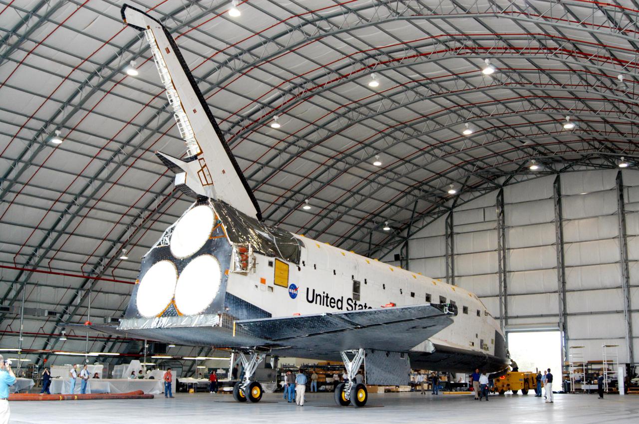 KENNEDY SPACE CENTER, FLA.  - The orbiter Endeavour arrives inside Florida Space Authority’s Reusable Launch Vehicle hangar where it is being held for temporary storage.  Endeavour was moved from the Orbiter Processing Facility (OPF) to allow work to be performed in the OPF that can only be accomplished while the bay is empty.   Work scheduled in the OPF includes modifications to the bay and platform validation in the bay.   Endeavour will remain in the hangar for approximately 30 days, then return to the OPF.  Endeavour was pulled out of service in December 2003 for Orbiter Major Modification (OMM).  OMMs are scheduled at regular intervals to enhance safety and performance, infuse new technology, and, in this case, perform RTF modifications.