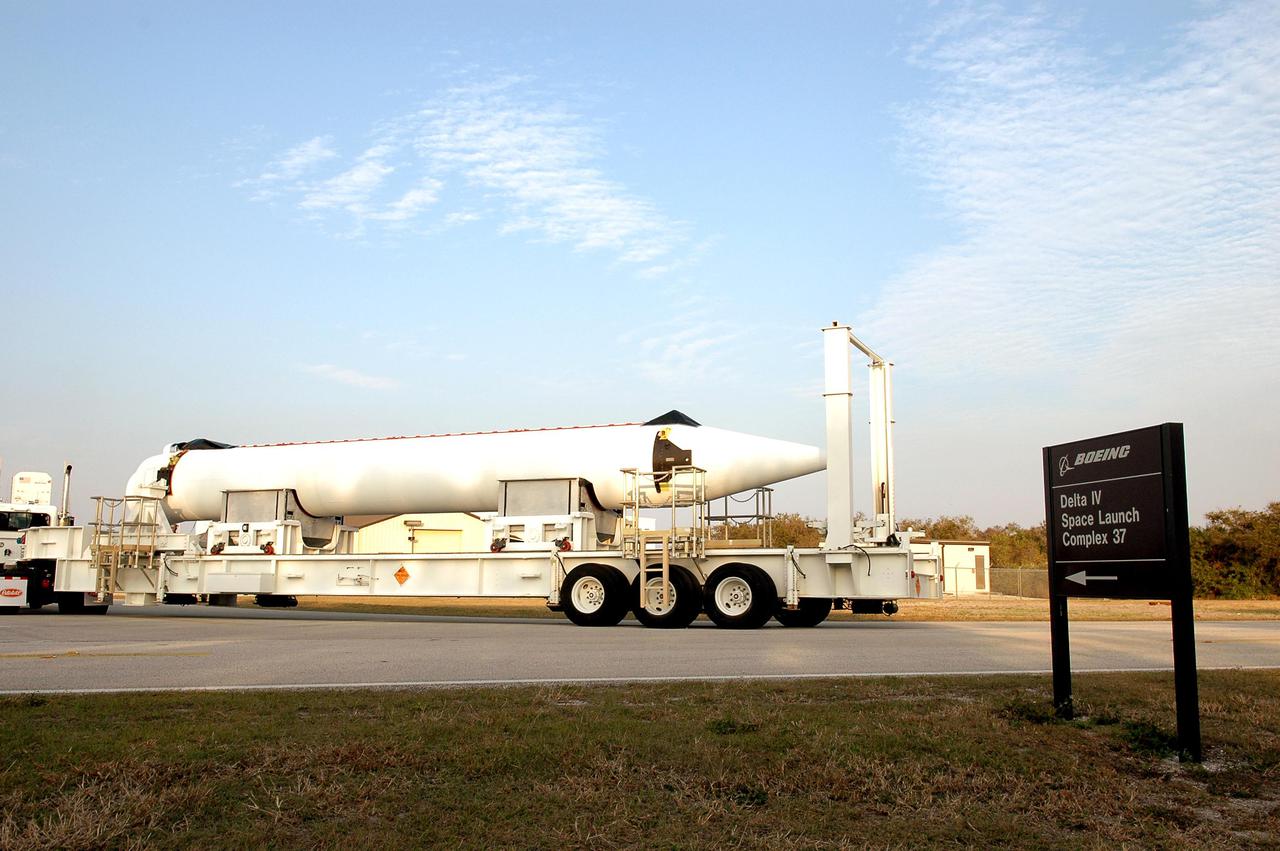 KENNEDY SPACE CENTER, FLA.  - A Solid Rocket Booster destined for the GOES-N launch turns toward Launch Complex 37 at Cape Canaveral Air Force Station for attachment to the Boeing Delta IV rocket.  The Delta IV is the launch vehicle for the GOES-N satellite, the first of three for the National Oceanic and Atmospheric Administration that will provide continuous monitoring necessary for intensive data analysis. GOES-N will provide a constant vigil for the atmospheric “triggers” of severe weather conditions such as tornadoes, flash floods, hail storms and hurricanes. When these conditions develop, GOES-N will be able to monitor storm development and track their movements.  NASA’s Goddard Space Flight Center is responsible for development of the satellite and testing of the spacecraft and its instruments.  GOES-N is scheduled for launch on May 4.