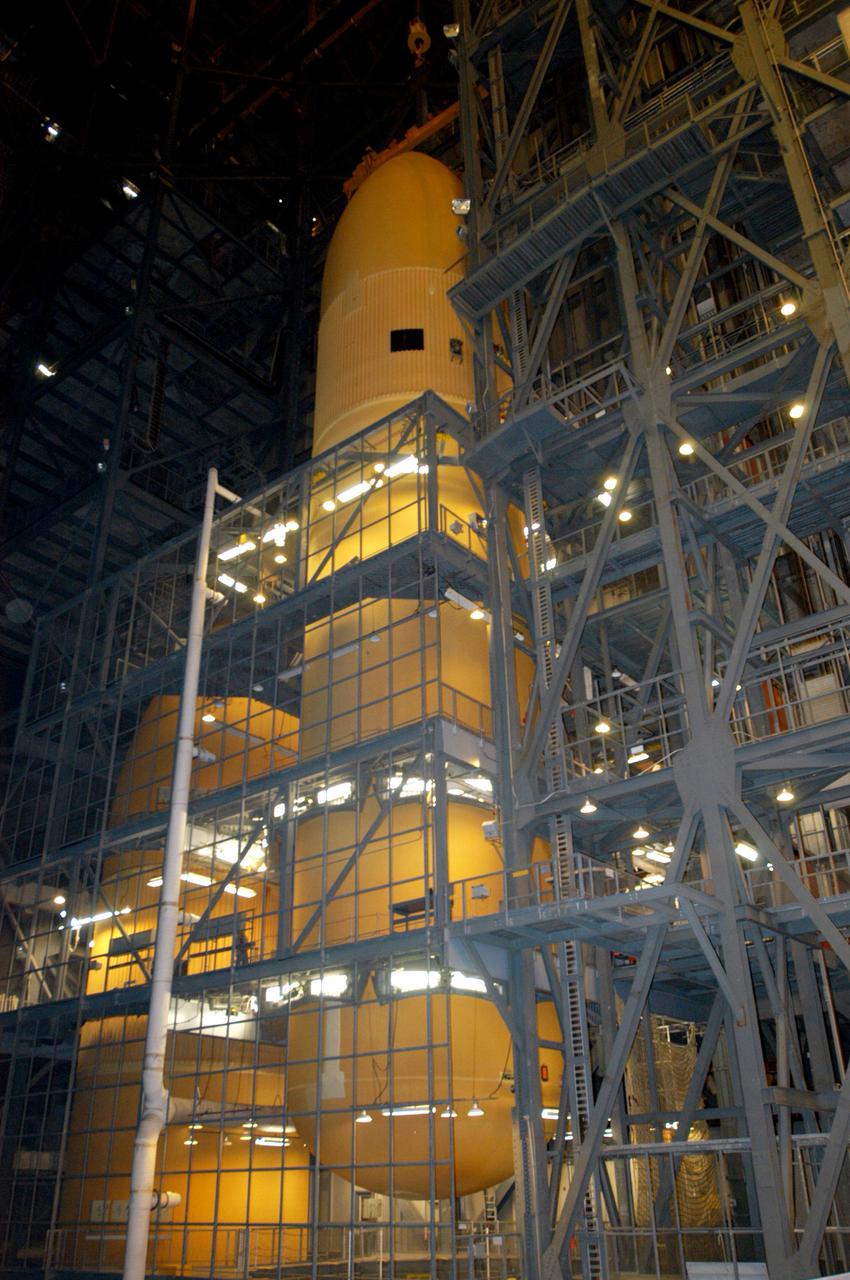 KENNEDY SPACE CENTER, FLA.  -  The External Tank (ET) designated to fly on Return to Flight mission STS-114 is lifted from a checkout cell to be mated with the Solid Rocket Boosters. The ET is recently redesigned  to meet recommendations of the Columbia Accident Investigation Board before return to flight.  Among dozens of changes is a redesigned forward bipod fitting to reduce the risk to the Space Shuttle from falling debris during ascent.  Considered a test flight, STS-114 is scheduled to launch during a window extending May 15 to June 3.  The Shuttle will carry supplies and equipment to the International Space Station.