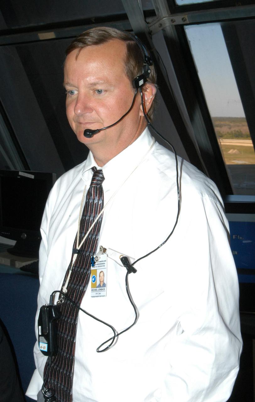 KENNEDY SPACE CENTER, FLA.  -  Shuttle Launch Director Mike Leinbach takes part in an End-to-End (ETE) Mission Management Team (MMT) launch simulation at KSC.  In Firing Room 1 at KSC, Shuttle launch team members put the Shuttle system through an integrated simulation. The control room is set up with software used to simulate flight and ground systems in the launch configuration.  The ETE MMT simulation included L-2 and L-1 day Prelaunch MMT meetings, an external tanking_weather briefing, and a launch countdown.  The ETE transitioned to the Johnson Space Center for the flight portion of the simulation, with the STS-114 crew in a simulator at JSC.  Such simulations are common before a launch to keep the Shuttle launch team sharp and ready for liftoff.