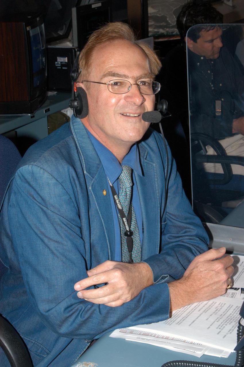 KENNEDY SPACE CENTER, FLA.  -  Public Information Officer George Diller plays his role as commentator during in an End-to-End (ETE) Mission Management Team (MMT) launch simulation at KSC.  In Firing Room 1 at KSC, Shuttle launch team members put the Shuttle system through an integrated simulation. The control room is set up with software used to simulate flight and ground systems in the launch configuration.  The ETE MMT simulation included L-2 and L-1 day Prelaunch MMT meetings, an external tanking_weather briefing, and a launch countdown.  The ETE transitioned to the Johnson Space Center for the flight portion of the simulation, with the STS-114 crew in a simulator at JSC.  Such simulations are common before a launch to keep the Shuttle launch team sharp and ready for liftoff.