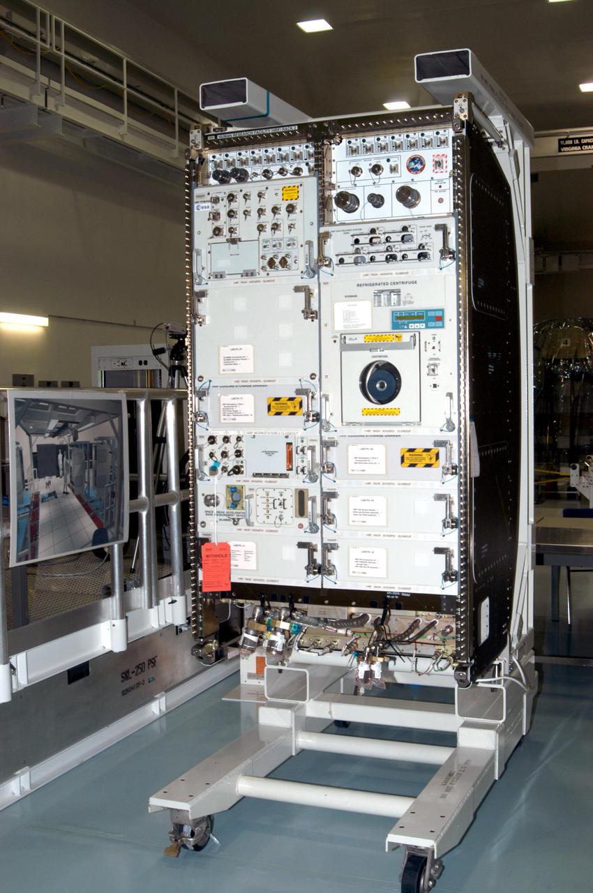 KENNEDY SPACE CENTER, FLA. - In the Space Station Processing Facility, the Human Research Facility-2 (HRF-2) science rack sits on a stand waiting to be installed into the Multi-Purpose Logistics Module Raffaello for flight on Space Shuttle Discovery’s Return to Flight mission, STS-114. The HRF-2 will deliver additional biomedical instrumentation and research capability to the International Space Station. HRF-1, installed on the U.S. Lab since May 2001, contains an ultrasound unit and gas analyzer. Both racks provide structural, power, thermal, command and data handling, and communication and tracking interfaces between the HRF biomedical instrumentation and the U.S. Laboratory, Destiny. NASA Kennedy Space Center and their prime contractor responsible for ISS element processing, The Boeing Company, prepared the rack for installation. The HRF Project is managed by NASA Johnson Space Center and implemented through contract with Lockheed Martin, Houston, Texas.