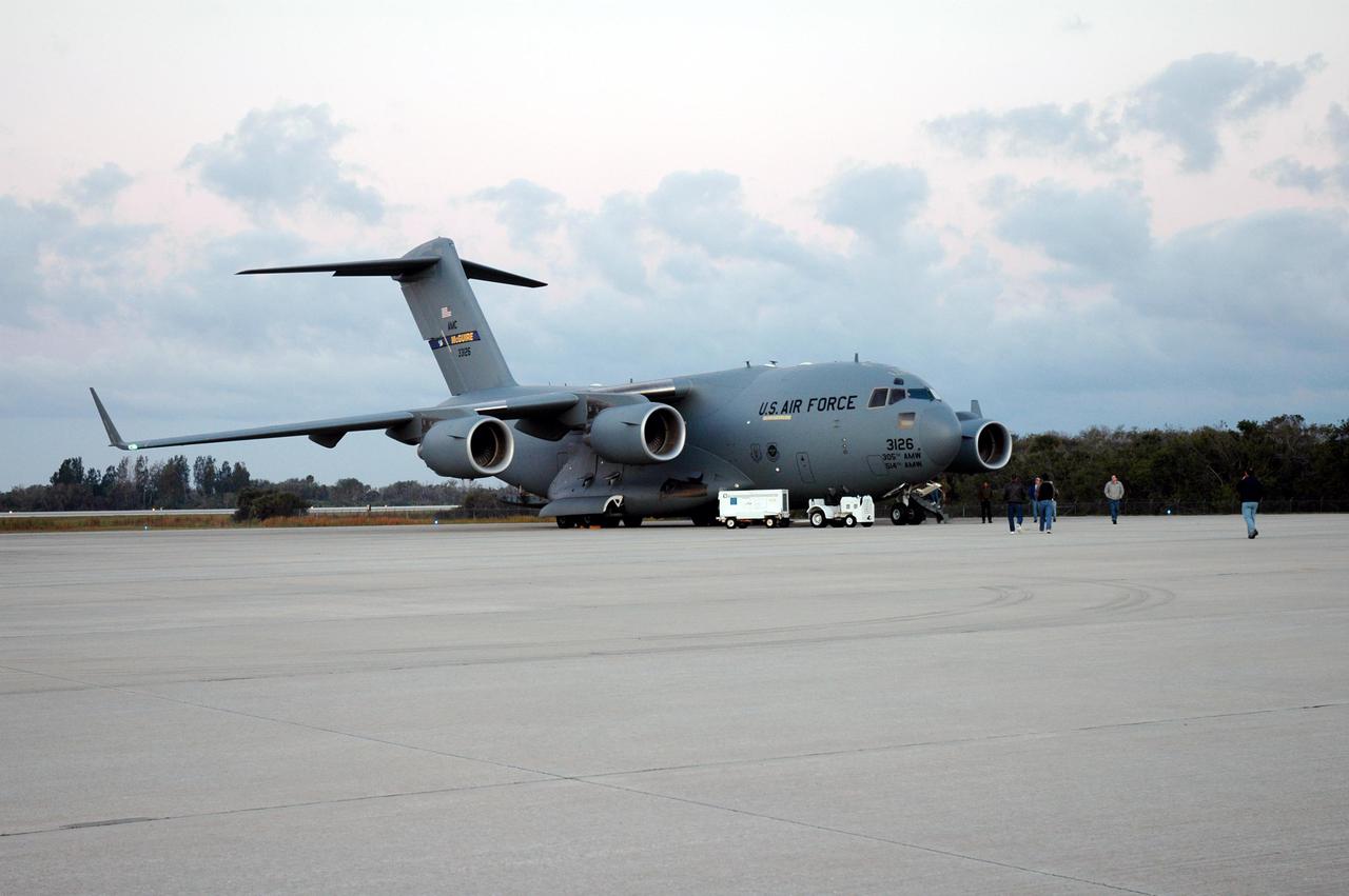 KENNEDY SPACE CENTER, FLA.  - A C17 military cargo aircraft at KSC’s Shuttle Landing Facility delivers the latest Geostationary Operational Environmental Satellite (GOES) developed by NASA for the National Oceanic and Atmospheric Administration (NOAA). Called GOES-N, the satellite is targeted to launch May 4 onboard a Boeing expendable launch vehicle Delta IV (4,2).   Once in orbit GOES-N will be designated GOES-13 and will complete checkout and be placed in on-orbit storage as a replacement for an older GOES satellite. After arriving, the satellite was transported to Astrotech in Titusville, Fla., where final testing of the imaging system, instrumentation, communications and power systems will be performed over the next two months by Boeing Satellite Systems.