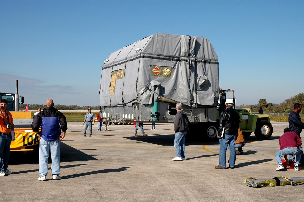 KENNEDY SPACE CENTER, FLA.  - At KSC’s Shuttle Landing Facility, the latest Geostationary Operational Environmental Satellite (GOES) developed by NASA for the National Oceanic and Atmospheric Administration (NOAA) is lifted so it can be placed on a transporter.  The satellite is being transported to Astrotech in Titusville, Fla., where final testing of the imaging system, instrumentation, communications and power systems will be performed over the next two months by Boeing Satellite Systems. Called GOES-N, the satellite is targeted to launch May 4 onboard a Boeing expendable launch vehicle Delta IV (4,2).  Once in orbit GOES-N will be designated GOES-13 and will complete checkout and be placed in on-orbit storage as a replacement for an older GOES satellite.