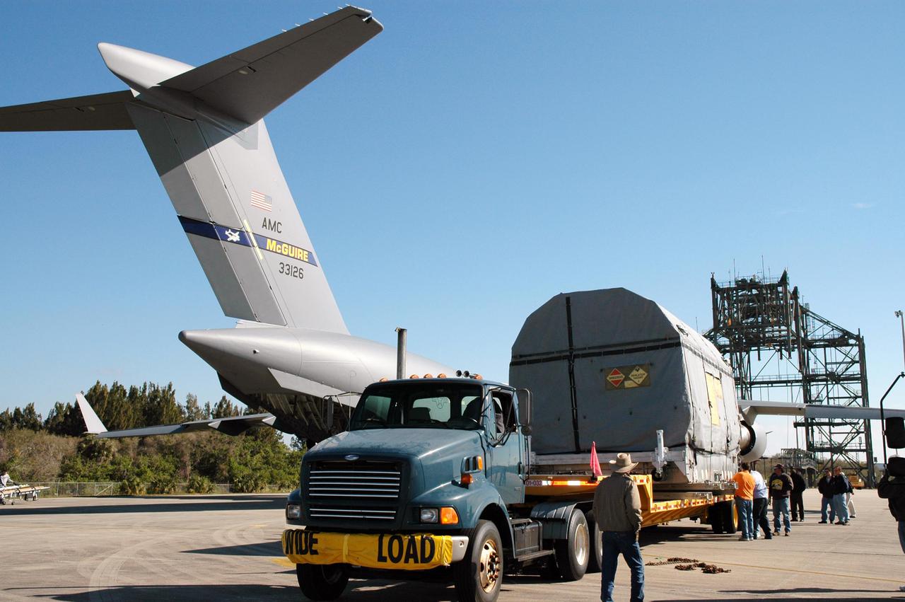KENNEDY SPACE CENTER, FLA.  - At KSC’s Shuttle Landing Facility, the latest Geostationary Operational Environmental Satellite (GOES) developed by NASA for the National Oceanic and Atmospheric Administration (NOAA) is secured on a transporter. The satellite is being transported to Astrotech in Titusville, Fla., where final testing of the imaging system, instrumentation, communications and power systems will be performed over the next two months by Boeing Satellite Systems. Called GOES-N, the satellite is targeted to launch May 4 onboard a Boeing expendable launch vehicle Delta IV (4,2).  Once in orbit GOES-N will be designated GOES-13 and will complete checkout and be placed in on-orbit storage as a replacement for an older GOES satellite.