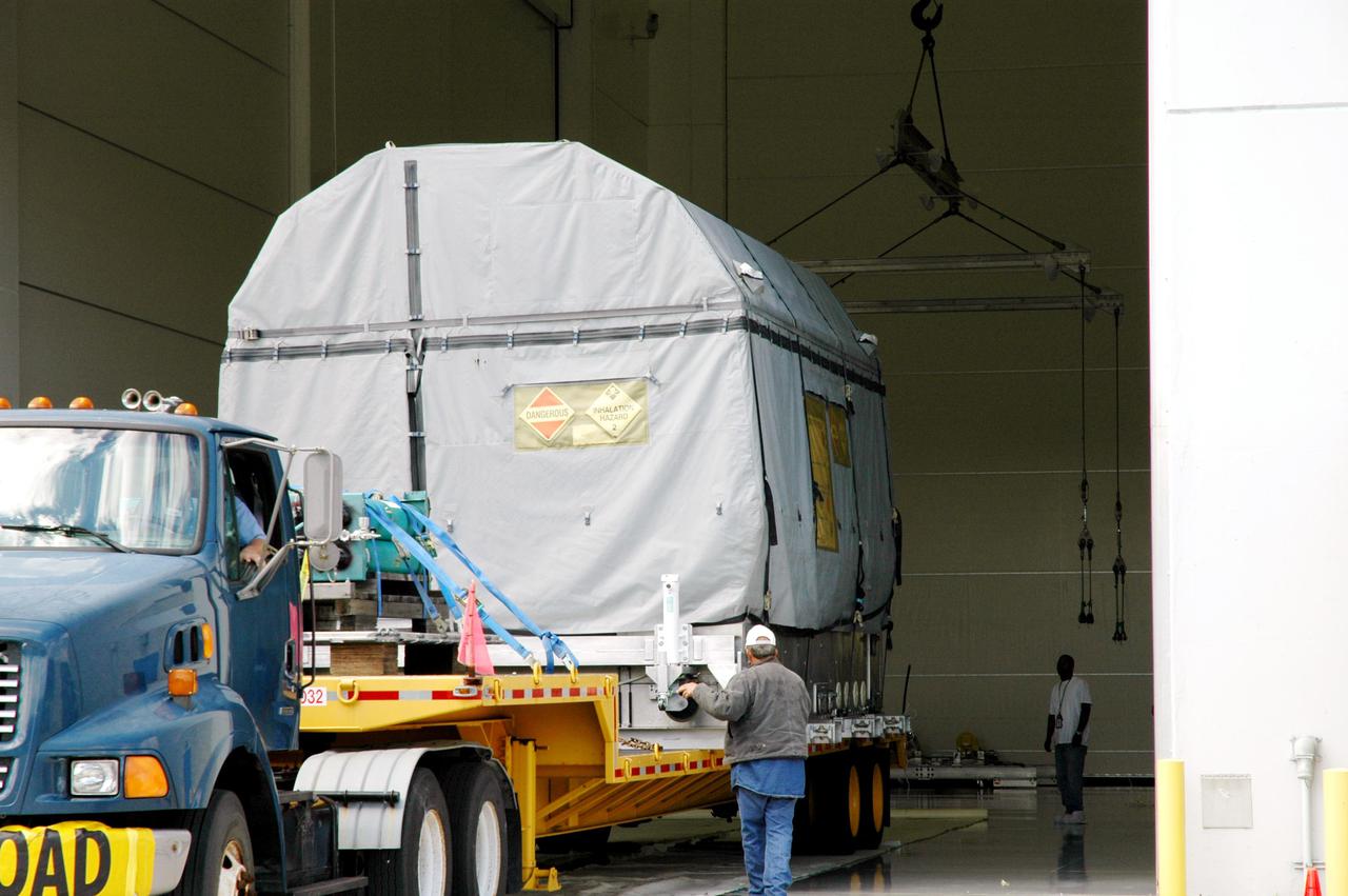 KENNEDY SPACE CENTER, FLA.  - The latest Geostationary Operational Environmental Satellite (GOES) developed by NASA for the National Oceanic and Atmospheric Administration (NOAA) is backed into a facility at Astrotech in Titusville, Fla.  There it will undergo final testing of the imaging system, instrumentation, communications and power systems will be performed over the next two months by Boeing Satellite Systems. The satellite arrived earlier at KSC’s Shuttle Landing Facility aboard a C17 military cargo aircraft.  Called GOES-N, the satellite is targeted to launch May 4 onboard a Boeing expendable launch vehicle Delta IV (4,2).  Once in orbit GOES-N will be designated GOES-13 and will complete checkout and be placed in on-orbit storage as a replacement for an older GOES satellite.