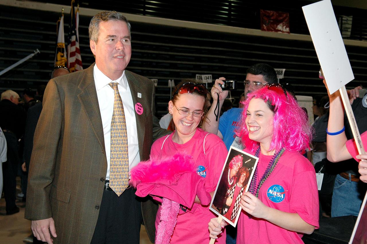 KENNEDY SPACE CENTER, FLA. - At the 2005 FIRST Robotics Regional Competition held at the University of Central Florida March 10-12, Florida Gov. Jeb Bush meets members of the Space Coast FIRST Robotics Team, known as the Pink Team. The NASA-sponsored Roccobots took first place in the competition as part of a three-team alliance and advances to the Championship in Atlanta in April. The Pink Team comprises students from Rockledge High School and Cocoa Beach Junior_Senior High School.