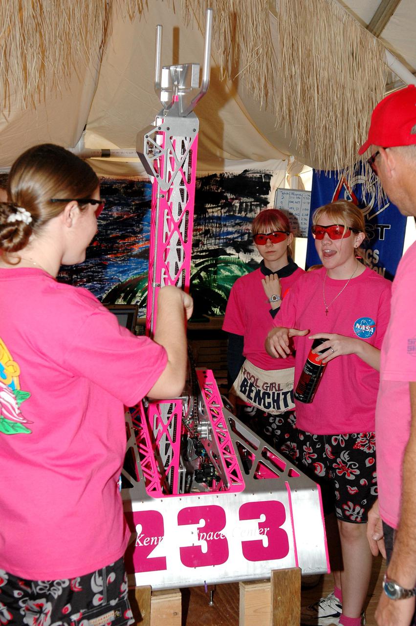KENNEDY SPACE CENTER, FLA. - Members of the Space Coast FIRST Robotics Team, known as the Pink Team, display their robot, Roccobot, at the 2005 FIRST Robotics Regional Competition held at the University of Central Florida March 10-12. The NASA-sponsored Pink Team took first place in the competition as part of a three-team alliance and advances to the Championship in Atlanta in April. The Pink Team comprises students from Rockledge High School and Cocoa Beach Junior_Senior High School.