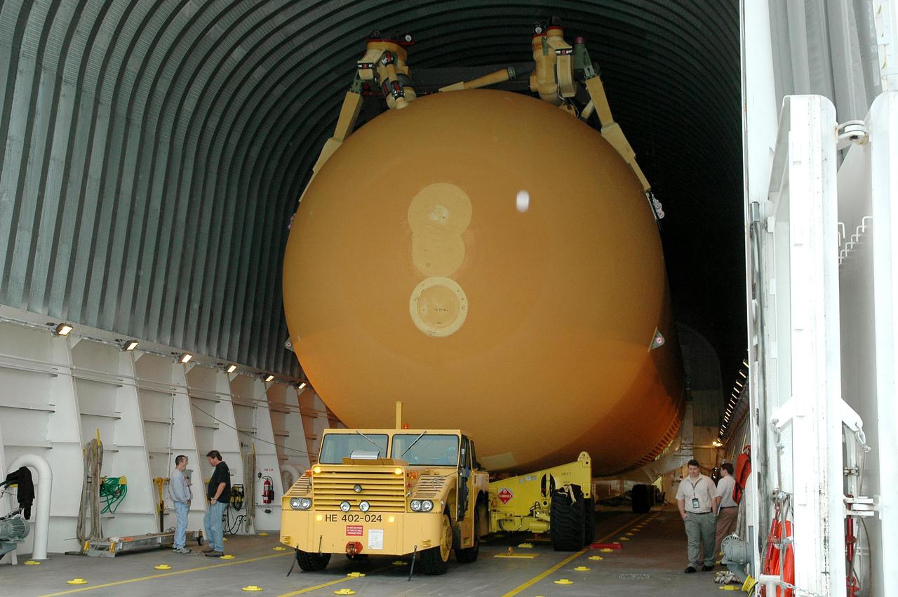 KENNEDY SPACE CENTER, FLA. - The second redesigned External Tank (ET-121) is ready to leave the barge at the Turn Basin near the Vehicle Assembly Building (VAB) after its 900-mile journey at sea from the Michoud Assembly Facility in New Orleans. It will then be offloaded and transported to the Vehicle Assembly Building at NASA’s Kennedy Space Center in Florida. In addition to the Return to Flight modifications, this tank has been outfitted with temperature sensors and accelerometers, used to measure vibration. These sensors will gather information about how the tank performs during flight. The tank is designated for use on Return to Flight mission STS-121, which has a launch window of July 12 to July 31, 2005.
