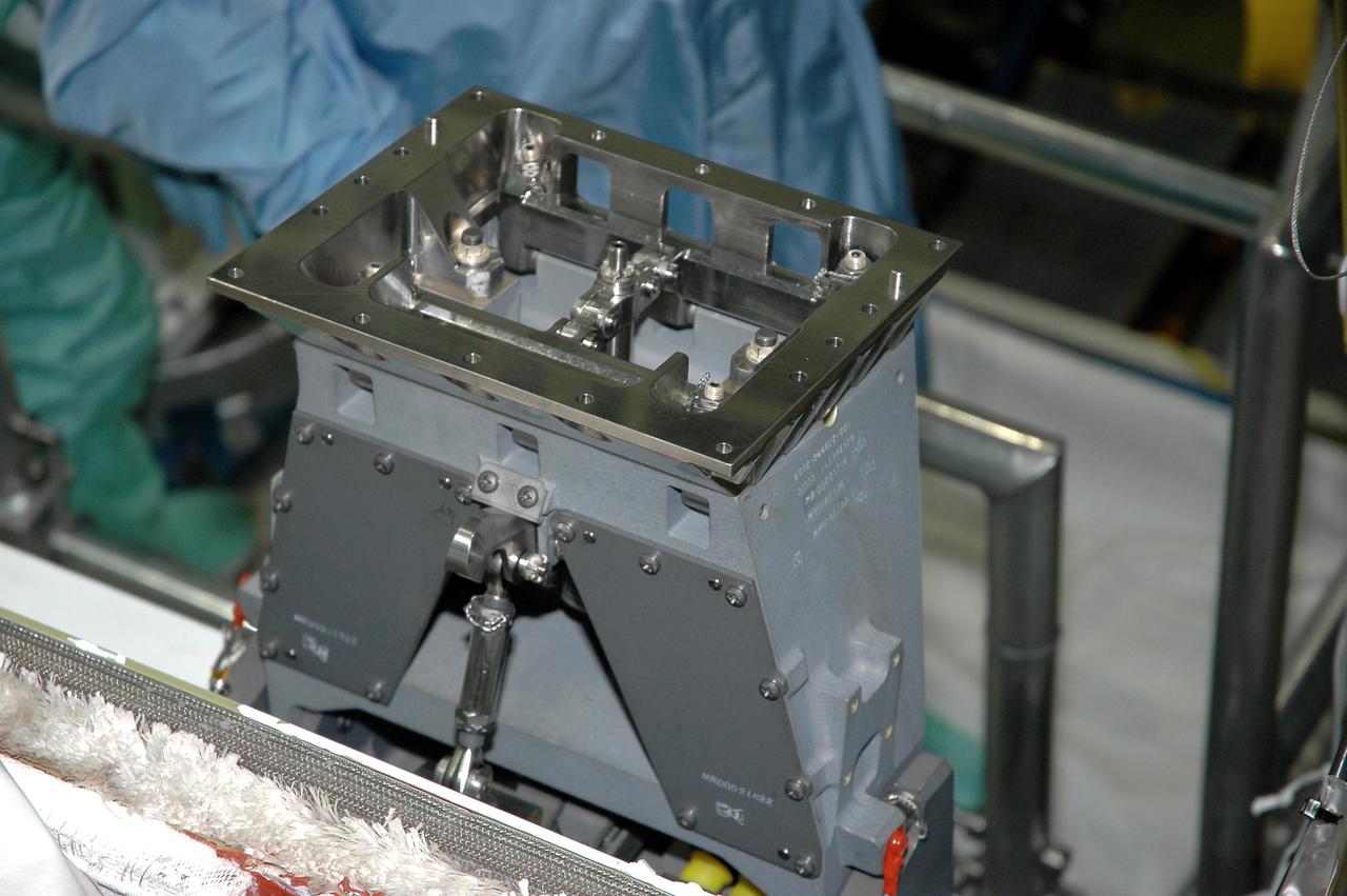 KENNEDY SPACE CENTER, FLA. - A close-up is shown of the base of the Manipulator Positioning Mechanism (MPM) installed on the starboard side of Atlantis’ payload bay in the Orbiter Processing Facility at NASA’s Kennedy Space Center. The MPM will hold the 50-foot-long Orbiter Boom Sensor System (OBSS) that will attach to the Remote Manipulator System, or Shuttle robotic arm. The OBSS is one of the new safety measures for Return to Flight, equipping the orbiter with cameras and laser systems to inspect the Shuttle's Thermal Protection System while in space. Atlantis is scheduled to fly on Return to Flight mission STS-121, which has a launch window of July 12 to July 31, 2005.