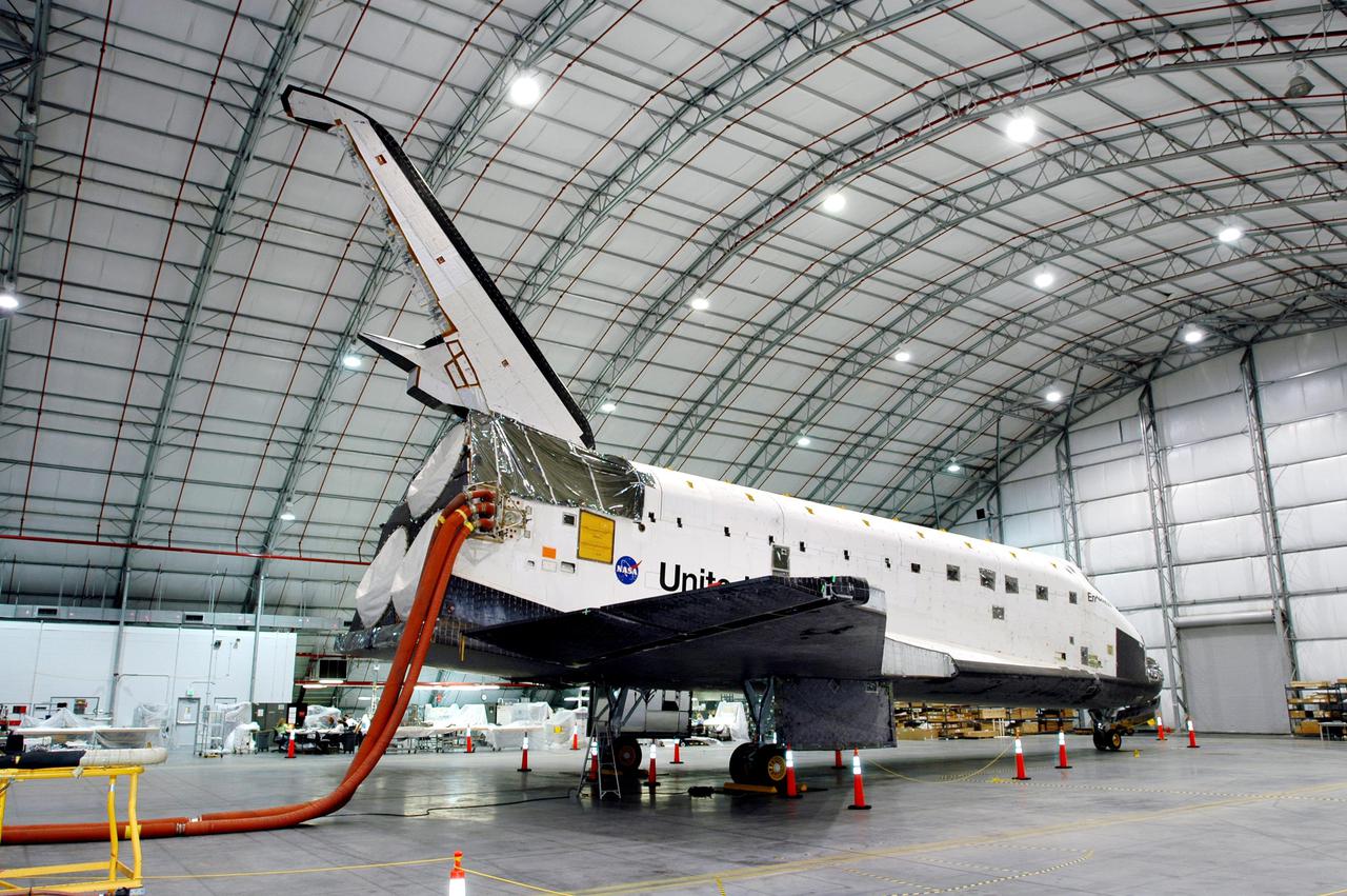 KENNEDY SPACE CENTER, FLA.  - The starboard side of orbiter Endeavour is shown from the rear as it sits inside the Florida Space Authority’s Reusable Launch Vehicle hangar at NASA’s Kennedy Space Center.   While in the hangar, Endeavour has undergone testing to see how orbiters respond to a new radar system that will be used during launch to detect debris.  Endeavour is returning to the Orbiter Processing Facility today to continue Orbiter Major Modifications (OMM).  OMMs are scheduled at regular intervals to enhance safety and performance, infuse new technology, and, in this case, perform Return to Flight modifications.