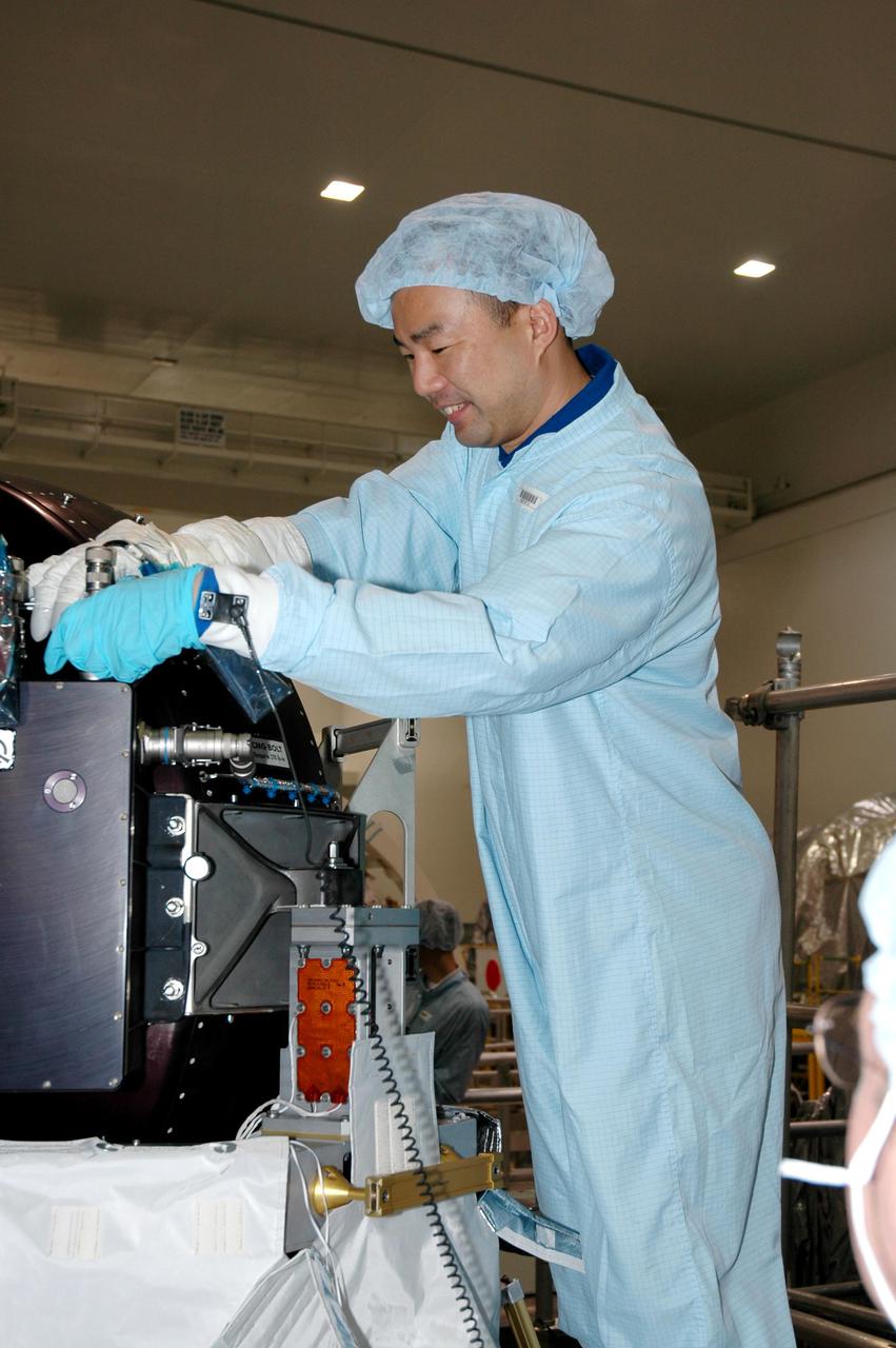 KENNEDY SPACE CENTER, FLA. - Members of the Space Shuttle Discovery’s Return to Flight STS-114 crew are conducting a payload Crew Equipment Interface Test (CEIT) in the Space Station Processing Facility at NASA’s Kennedy Space Center, Fla. Seen here is Mission Specialist Soichi Noguchi, who is with the Japanese Aerospace Exploration Agency. The launch window for STS-114 is May 15 to June 3, 2005. During CEIT, the crew is inspecting the resupply stowage racks installed in the Italian-built Multi-Purpose Logistics Module Raffaello and performing tool and equipment interface checks with the Thermal Protection System (TPS) repair sample box, the Control Moment Gyroscope (CMG) and the External Stowage Platform-2 in preparation for the mission’s three scheduled spacewalks. The seven-member crew will fly to the International Space Station primarily to evaluate procedures for flight safety, including Shuttle inspection and repair techniques. The TPS repair sample box contains tile samples for the Detailed Test Objective (DTO) that will enable the crew to test new on-orbit TPS repair techniques. The CMG installed on the Lightweight Multi-Purpose Experiment Support Structure Carrier (LMC) is a replacement for an inoperable CMG on the International Space Station. The CMGs provide altitude control for the outpost keeping it properly oriented toward the Sun without use of rocket fuel. The ESP2 will carry replacement parts, known as orbital replacement units (ORU) to the Station. The platform will be deployed and attached to the Station’s airlock and will be used as a permanent spare parts facility.