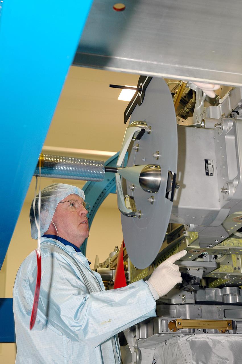 KENNEDY SPACE CENTER, FLA. - During Crew Equipment Interface Test (CEIT) at SPACEHAB in Cape Canaveral, Fla., STS-114 Mission Specialist Andrew Thomas inspects External Stowage Platform-2 (ESP2). As payload on Space Shuttle Discovery’s Return to Flight mission, the ESP2 will carry replacement parts, known as orbital replacement units (ORU) to the International Space Station. The platform will be deployed and attached to the Station’s airlock and will be used as a permanent spare parts facility. The launch window for STS-114 is May 15 to June 3, 2005. Earlier, during CEIT in the Space Station Processing Facility, the crew also inspected the resupply stowage racks installed in the Italian-built Multi-Purpose Logistics Module Raffaello and performed tool and equipment interface checks with the Thermal Protection System (TPS) repair sample box, and the Control Moment Gyroscope (CMG) in preparation for the mission’s three scheduled spacewalks. The seven-member crew will fly to the Space Station primarily to evaluate procedures for flight safety, including Shuttle inspection and repair techniques.