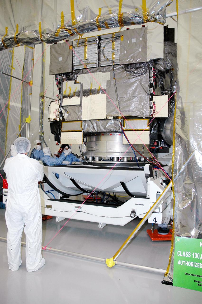 KENNEDY SPACE CENTER, FLA. - The GOES-N satellite is checked out on the rotation stand at Astrotech in Titusville, Fla. Since its arrival on March 11, the satellite has been undergoing final testing by Boeing Satellite Systems of the imaging system, instrumentation, communications and power systems. Geostationary Operational Environmental Satellites (GOES) are sponsored by the NASA’s Goddard Space Flight Center and the National Oceanic and Atmospheric Administration. GOES-N is targeted to launch May 4 onboard a Boeing expendable launch vehicle Delta IV (4,2) with a 3-burn second stage operation. Once in orbit GOES-N will be designated GOES-13 and will complete checkout and be placed in on-orbit storage as a replacement for an older GOES satellite. GOES-N is the first in the next series of GOES satellites, N-P. The multi-mission GOES series N-P will be a vital contributor to weather, solar and space operations and science. The GOES N-P series will aid activities ranging from severe storm warnings to resource management and advances in science.