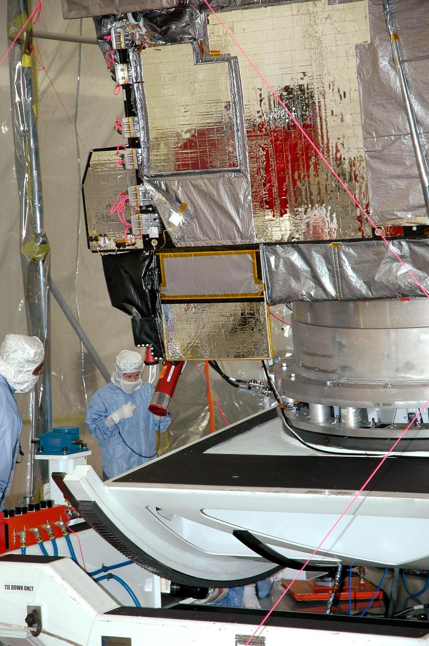 KENNEDY SPACE CENTER, FLA. - The GOES-N satellite is checked out on the rotation stand at Astrotech in Titusville, Fla. Since its arrival on March 11, the satellite has been undergoing final testing by Boeing Satellite Systems of the imaging system, instrumentation, communications and power systems. Geostationary Operational Environmental Satellites (GOES) are sponsored by the NASA’s Goddard Space Flight Center and the National Oceanic and Atmospheric Administration. GOES-N is targeted to launch May 4 onboard a Boeing expendable launch vehicle Delta IV (4,2) with a 3-burn second stage operation. Once in orbit GOES-N will be designated GOES-13 and will complete checkout and be placed in on-orbit storage as a replacement for an older GOES satellite. GOES-N is the first in the next series of GOES satellites, N-P. The multi-mission GOES series N-P will be a vital contributor to weather, solar and space operations and science. The GOES N-P series will aid activities ranging from severe storm warnings to resource management and advances in science.