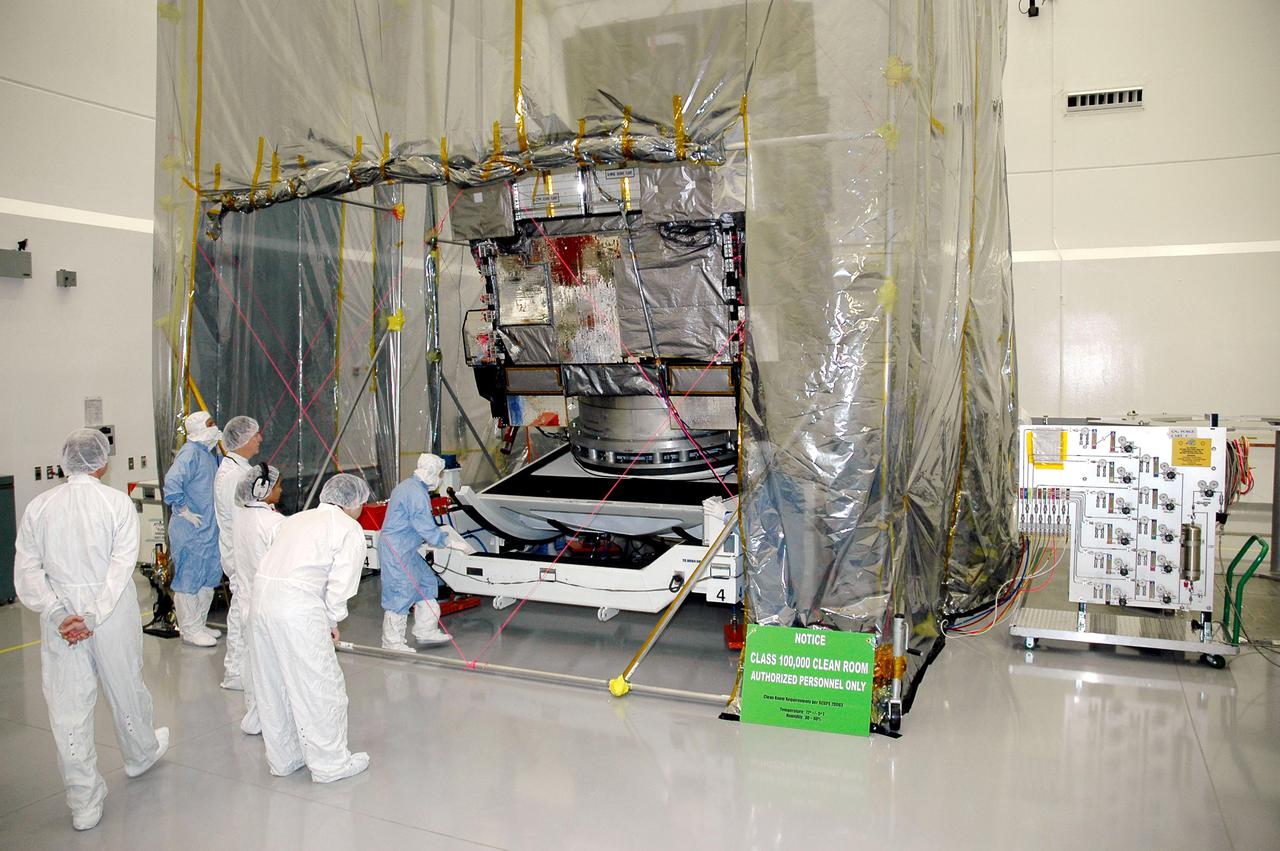 KENNEDY SPACE CENTER, FLA. - At Astrotech in Titusville, Fla., the GOES-N satellite begins rotation. Since its arrival on March 11, the satellite has been undergoing final testing by Boeing Satellite Systems of the imaging system, instrumentation, communications and power systems. Geostationary Operational Environmental Satellites (GOES) are sponsored by the NASA’s Goddard Space Flight Center and the National Oceanic and Atmospheric Administration. GOES-N is targeted to launch May 4 onboard a Boeing expendable launch vehicle Delta IV (4,2) with a 3-burn second stage operation. Once in orbit GOES-N will be designated GOES-13 and will complete checkout and be placed in on-orbit storage as a replacement for an older GOES satellite. GOES-N is the first in the next series of GOES satellites, N-P. The multi-mission GOES series N-P will be a vital contributor to weather, solar and space operations and science. The GOES N-P series will aid activities ranging from severe storm warnings to resource management and advances in science.