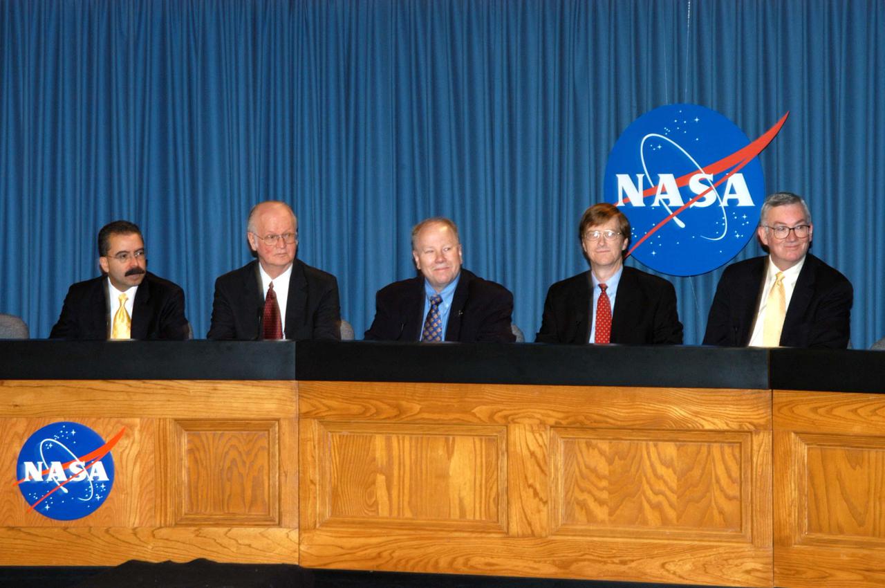 KENNEDY SPACE CENTER, FLA. - Representatives of NASA’s New Horizons Mission to Pluto are ready to answer questions during a press briefing on the Draft environmental Impact Statement at NASA’s Kennedy Space Center. From left are Orlando Figueroa, deputy association administrator for Programs, Science Mission Directorate; Earl Wahlquist, associate director for Space and Defense Power Systems, Department of Energy, in Germantown, Md.; Kurt Lindstrom, New Horizons Program executive, with NASA; Hal Weaver, New Horizons Project scientist, Johns Hopkins University Applied Physics Laboratory in Laurel, Md.; and Glen Fountain, New Horizons Project manager, also with Johns Hopkins University Applied Physics Laboratory. The spacecraft will explore Pluto, its moon Charon, and possibly one or more objects within the Kuiper Belt. New Horizons is planned for launch during a window from Jan. 11 to Feb. 14, 2006, on an Atlas V 551 booster with a Star 48B third stage. It will proceed to a Jupiter gravity assist between Feb. 25 and March 2, 2007, if launched during the first 23 days of the launch window. (If it is launched during the last 12 days of the launch window it will have a direct-to-Pluto trajectory. There is a backup launch opportunity in February 2007.)