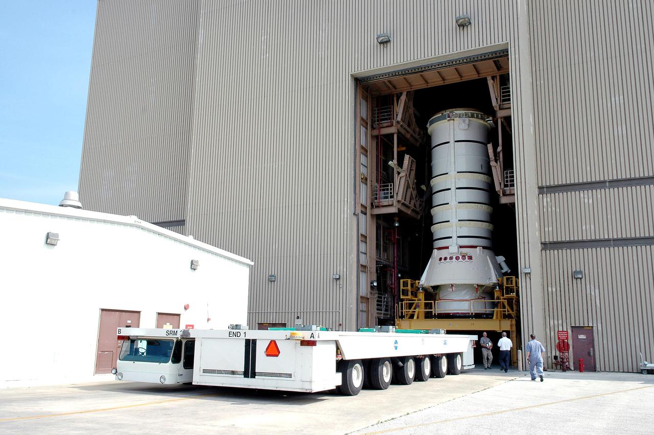 KENNEDY SPACE CENTER, FLA. -  The aft segment of a Solid Rocket Booster (SRB) is ready to roll out of the Rotation Processing and Surge Facility at NASA’s Kennedy Space Center.  The segment is being moved to the Vehicle Assembly Building where it will be mated with other segments for use on the launch of Space Shuttle Atlantis on the second Return to Flight mission, STS-121. SRBs are used as matched pairs and each is made up of four solid rocket motor segments.  Two SRBs provide the main thrust to lift the Space Shuttle off the pad to an altitude of about 150,000 feet. In addition, the two SRBs carry the entire weight of the External Tank and orbiter and transmit the weight load through their structure to the Mobile Launcher Platform. Each booster has a thrust (sea level) of approximately 3,300,000 pounds at launch, and provide 71.4 percent of the thrust at liftoff and during first-stage ascent.