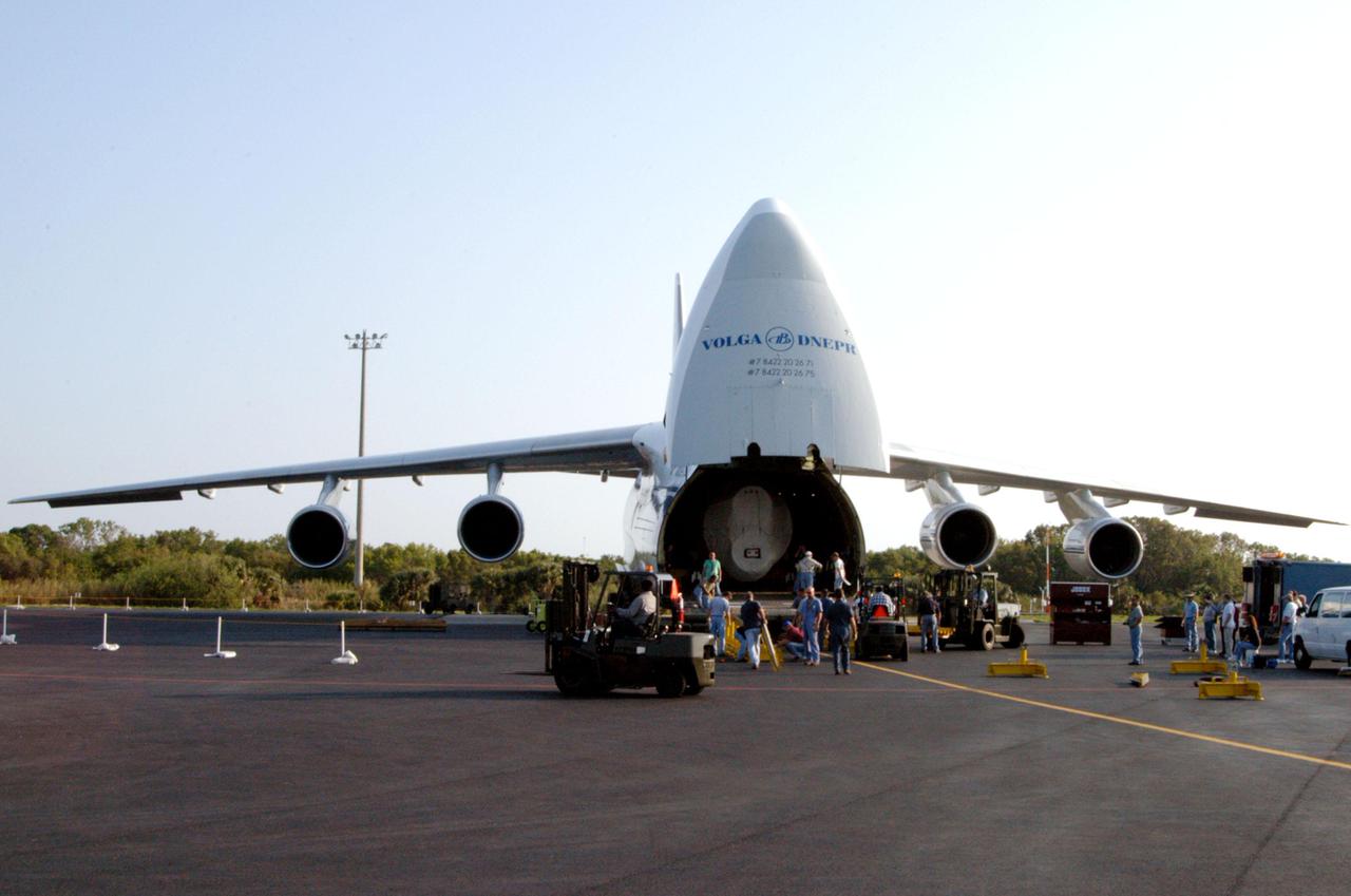 KENNEDY SPACE CENTER, FLA. - At the Cape Canaveral Air Force Station Skid Strip, workers begin offloading the booster segment for a Lockheed Martin Atlas V from a Russian Antonov AH-124-100 cargo airplane. The Atlas V, designated AV-007, is the launch vehicle for the Mars Reconnaissance Orbiter (MRO). The MRO is designed for a series of global mapping, regional survey and targeted observations from a near-polar, low-altitude Mars orbit. These observations will be unprecedented in terms of the spatial resolution and coverage achieved by the orbiter’s instruments as they observe the atmosphere and surface of Mars while probing its shallow subsurface as part of a “follow the water” strategy. The orbiter is undergoing environmental tests in facilities at Lockheed Martin Space Systems in Denver, Colo., and is on schedule for a launch window that begins Aug. 10. Launch will be from Launch Pad 41 at Cape Canaveral Air Force Station in Florida.