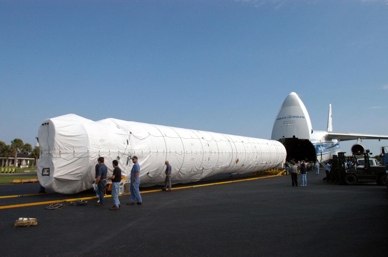 KENNEDY SPACE CENTER, FLA. - At the Cape Canaveral Air Force Station Skid Strip, the booster segment for a Lockheed Martin Atlas V is clear of the Russian Antonov AH-124-100 cargo airplane that brought it.  The Atlas V, designated AV-007, is the launch vehicle for the Mars Reconnaissance Orbiter (MRO).  The MRO is designed for a series of global mapping, regional survey and targeted observations from a near-polar, low-altitude Mars orbit. These observations will be unprecedented in terms of the spatial resolution and coverage achieved by the orbiter’s instruments as they observe the atmosphere and surface of Mars while probing its shallow subsurface as part of a “follow the water” strategy.  The orbiter is undergoing environmental tests in facilities at Lockheed Martin Space Systems in Denver, Colo., and is on schedule for a launch window that begins Aug. 10. Launch will be from Launch Pad 41 at Cape Canaveral Air Force Station in Florida.