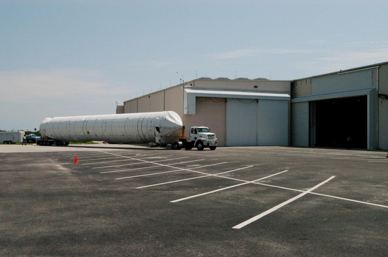KENNEDY SPACE CENTER, FLA. - The Lockheed Martin Atlas V booster segment arrives at Atlas Space Operations Center at Cape Canaveral Air Force Station. The Atlas V, designated AV-007, is the launch vehicle for the Mars Reconnaissance Orbiter (MRO). The MRO is designed for a series of global mapping, regional survey and targeted observations from a near-polar, low-altitude Mars orbit. These observations will be unprecedented in terms of the spatial resolution and coverage achieved by the orbiter’s instruments as they observe the atmosphere and surface of Mars while probing its shallow subsurface as part of a “follow the water” strategy. The orbiter is undergoing environmental tests in facilities at Lockheed Martin Space Systems in Denver, Colo., and is on schedule for a launch window that begins Aug. 10. Launch will be from Launch Pad 41 at Cape Canaveral Air Force Station in Florida.