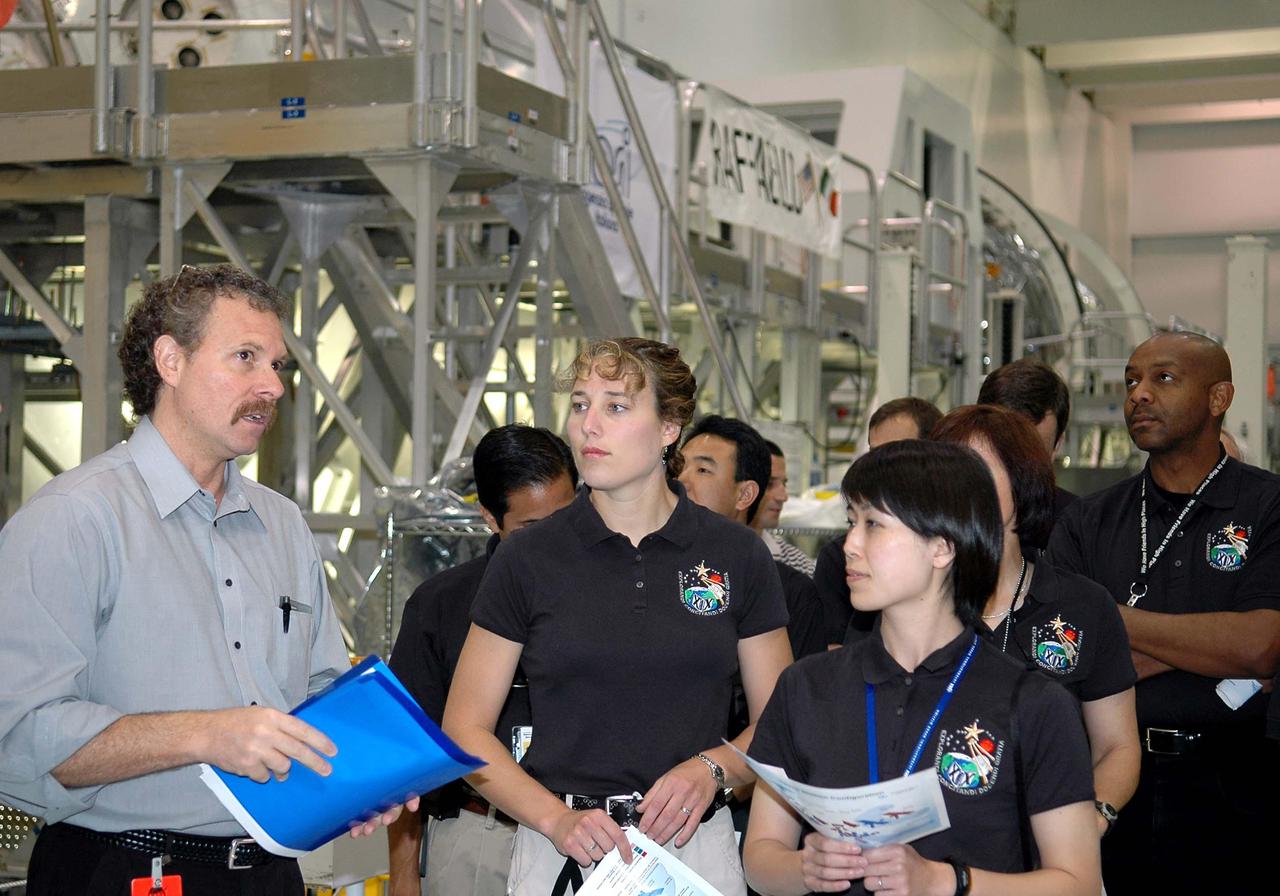 KENNEDY SPACE CENTER, FLA. -  Russell Romanella (left), deputy director of ISS and Payload Processing, talks with the 2004 class of astronaut candidates on their tour of the Space Station Processing Facility at NASA’s Kennedy Space Center.  The class of 14 candidates includes three candidates from the Japan Aerospace Exploration Agency as well as three educator astronauts, who were school teachers chosen from thousands of applicants.