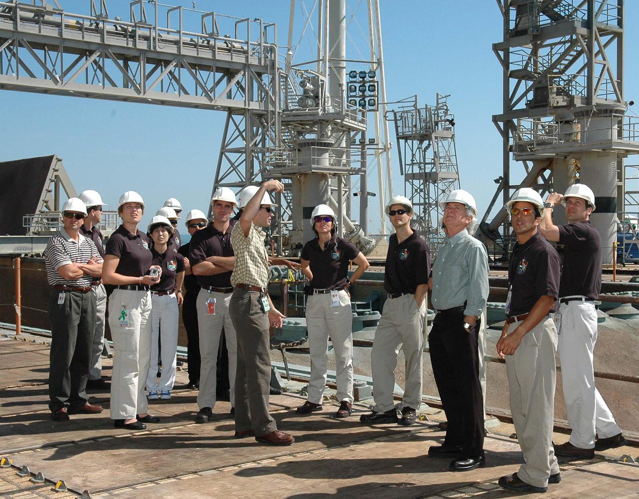 KENNEDY SPACE CENTER, FLA. -  At NASA’s Kennedy Space Center, the 2004 class of astronaut candidates tour Launch Pad 39B, where Space Shuttle Discovery will launch on Return to Flight mission STS-114 during a launch window of May 15 to June 3. The class of 14 candidates includes three candidates from the Japan Aerospace Exploration Agency as well as three educator astronauts, who were school teachers chosen from thousands of applicants.