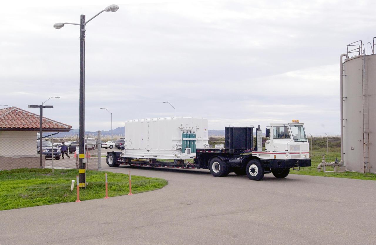 VANDENBERG AIR FORCE BASE, CALIF. - At Vandenberg Air Force Base in California, the National Oceanic and Atmospheric Administration (NOAA-N) spacecraft is being transported to a hangar for preflight processing. The NOAA-N satellite will be placed into a polar orbit aboard a Boeing Delta 2 rocket.  The spacecraft will continue to provide a polar-orbiting platform to support (1) environmental monitoring instruments for imaging and measuring the Earth's atmosphere, its surface, and cloud cover, including Earth radiation, atmospheric ozone, aerosol distribution, sea surface temperature, and vertical temperature and water profiles in the troposphere and stratosphere; (2) measurement of proton and electron flux at orbit altitude; (3) data collection from remote platforms; and (4) the Search and Rescue Satellite-Aided Tracking (SARSAT) system.  Additionally, NOAA-N is the fourth in the series of support dedicated microwave instruments for the generation of temperature, moisture, surface, and hydrological products in cloudy regions where visible and infrared (IR) instruments have decreased capability.  Launch is currently scheduled for no earlier than May 11, 2005.