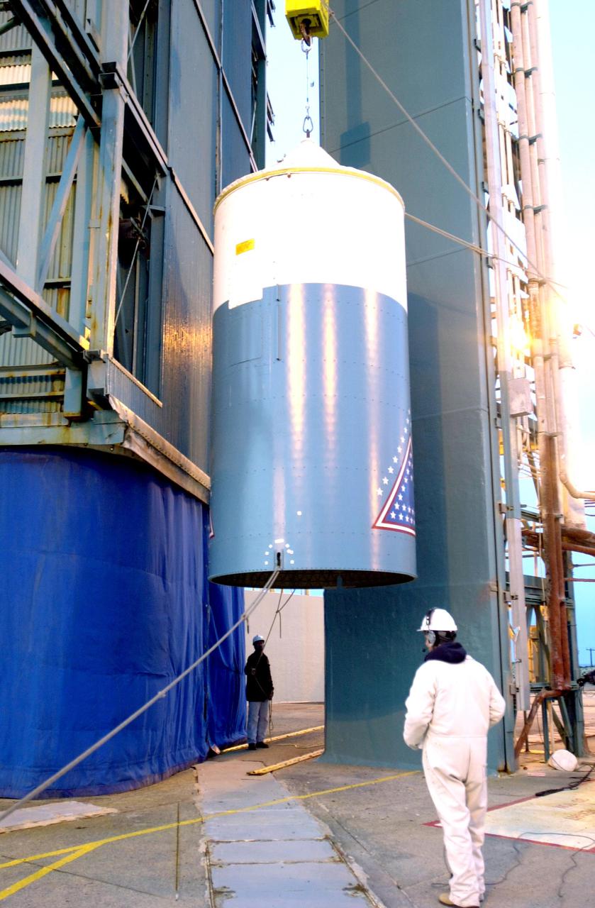 VANDENBERG AIR FORCE BASE, CALIF. - -  The interstage of a Boeing Delta 2 rocket is lifted up the launch service tower on Space Launch Complex 2 at Vandenberg Air Force Base in California.  It will be mated with the first stage in the launch service tower. The Delta 2 is the launch vehicle for the National Oceanic and Atmospheric Administration (NOAA-N) spacecraft.  NOAA-N is the fourth in the series of support dedicated microwave instruments for the generation of temperature, moisture, surface, and hydrological products in cloudy regions where visible and infrared (IR) instruments have decreased capability.  Launch aboard a Boeing Delta II rocket is currently scheduled for no earlier than May 11, 2005.