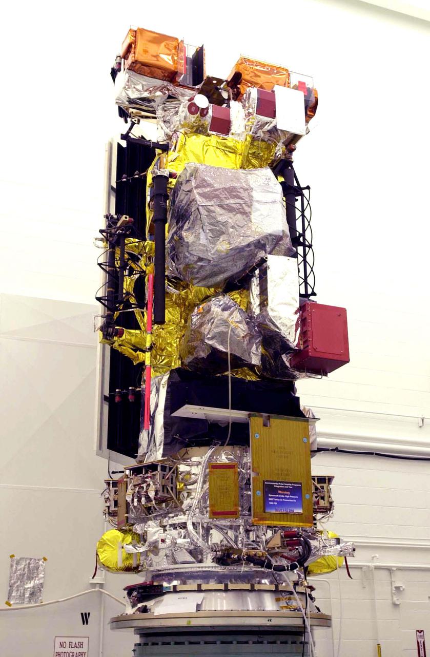VANDENBERG AIR FORCE BASE, CALIF. - Inside the NASA spacecraft processing hangar 1610 located on North Vandenberg Air Force Base in California, the National Oceanic and Atmospheric Administration (NOAA-N) spacecraft is seen from a different view on an assembly and test stand.  It will be mated to the Delta II payload attach fitting.  Launch of NOAA-N aboard the Boeing Delta II rocket is currently scheduled for May 11, 2005.  NOAA-N is the fourth in the series of support dedicated microwave instruments for the generation of temperature, moisture, surface, and hydrological products in cloudy regions where visible and infrared (IR) instruments have decreased capability.