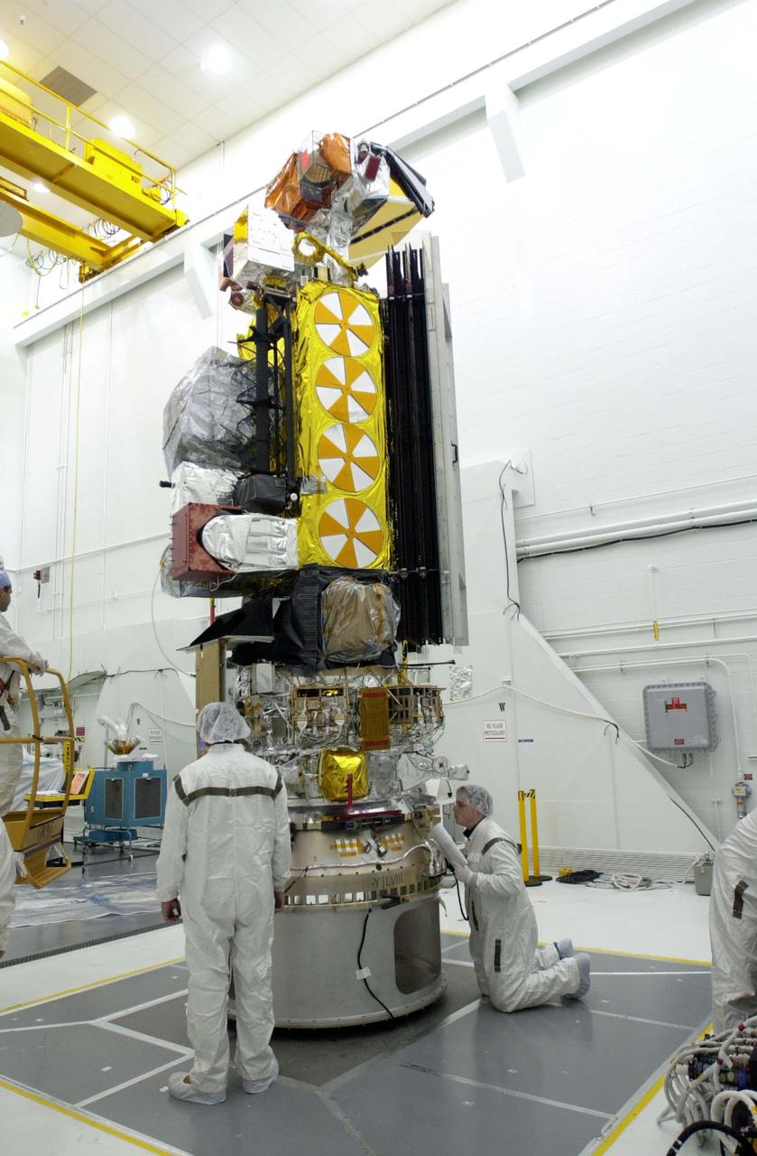 VANDENBERG AIR FORCE BASE, CALIF. -  Inside the NASA spacecraft processing hangar 1610 located on North Vandenberg Air Force Base in California, Lockheed Martin workers check connections on the National Oceanic and Atmospheric Administration (NOAA-N) spacecraft.  Launch of NOAA-N aboard the Boeing Delta II rocket is currently scheduled for May 11, 2005.  NOAA-N is the fourth in the series of support dedicated microwave instruments for the generation of temperature, moisture, surface, and hydrological products in cloudy regions where visible and infrared (IR) instruments have decreased capability.