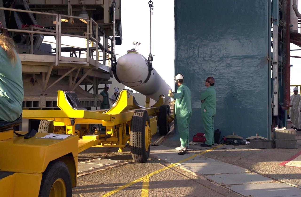 VANDENBERG AIR FORCE BASE, CALIF. -  After its arrival at Space Launch Complex 2 on Vandenberg Air Force Base in California, one of three Solid Rocket Boosters is lifted from the transporter and will be raised to a vertical position.  It will be lifted up the launch service tower and mated with a Boeing Delta II rocket for the launch of the National Oceanic and Atmospheric Administration (NOAA-N) spacecraft.   Launch of NOAA-N aboard the Boeing Delta II rocket is currently scheduled for May 11, 2005.  NOAA-N is the fourth in the series of support dedicated microwave instruments for the generation of temperature, moisture, surface, and hydrological products in cloudy regions where visible and infrared (IR) instruments have decreased capability.