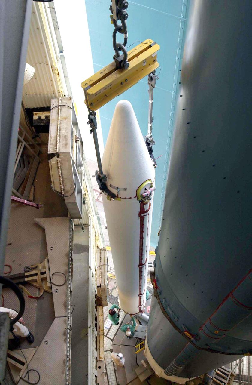 VANDENBERG AIR FORCE BASE, CALIF. -  At Space Launch Complex 2 on Vandenberg Air Force Base in California,  the first of three Solid Rocket Boosters is lifted alongside the first stage of a Boeing Delta II rocket for mating.  The Boeing Delta II will launch the National Oceanic and Atmospheric Administration (NOAA-N) spacecraft.  Launch of NOAA-N aboard the Boeing Delta II rocket is currently scheduled for May 11, 2005.  NOAA-N is the fourth in the series of support dedicated microwave instruments for the generation of temperature, moisture, surface, and hydrological products in cloudy regions where visible and infrared (IR) instruments have decreased capability.