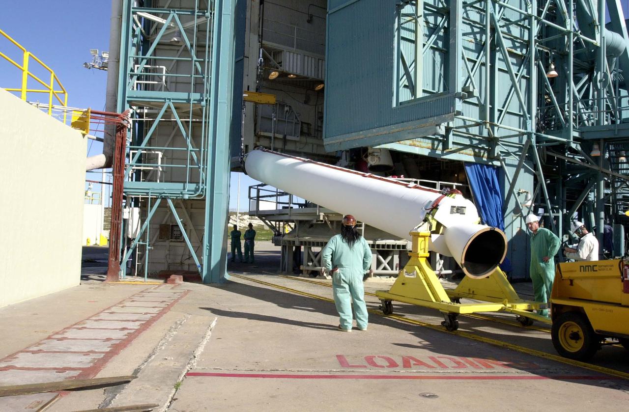 VANDENBERG AIR FORCE BASE, CALIF. -  Another Solid Rocket Booster arrives at Space Launch Complex 2 on Vandenberg Air Force Base in California.  It will be mated with a Boeing Delta II rocket for the launch of the National Oceanic and Atmospheric Administration (NOAA-N) spacecraft.  Launch of NOAA-N aboard the Boeing Delta II rocket is currently scheduled for May 11, 2005.  NOAA-N is the fourth in the series of support dedicated microwave instruments for the generation of temperature, moisture, surface, and hydrological products in cloudy regions where visible and infrared (IR) instruments have decreased capability.