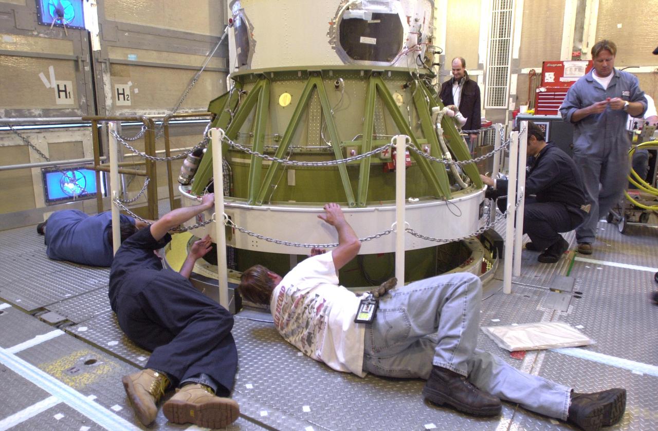 VANDENBERG AIR FORCE BASE, CALIF. - Inside the service tower at Space Launch Complex 2 on Vandenberg Air Force Base in California, Boeing workers get ready to mate the second stage (above) to the first stage of a Boeing Delta II rocket. The Delta II will launch the National Oceanic and Atmospheric Administration (NOAA-N) spacecraft. After launch, NOAA-N will be renamed NOAA-18 and will provide measurements of the Earth's surface and atmosphere that will be entered into NOAA’s weather forecasting models and used for other environmental studies. Each day, the satellite will send data to NOAA’s Command and Data Acquisition station computers, adding vital information to forecasting models, especially over the oceans, where conventional data is lacking. Launch of NOAA-N is scheduled for May 11, 2005.