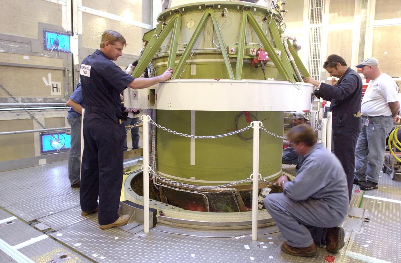 VANDENBERG AIR FORCE BASE, CALIF. - Inside the service tower at Space Launch Complex 2 on Vandenberg Air Force Base in California, Boeing workers attach the second stage to the first stage, below, of a Boeing Delta II rocket. The Delta II will launch the National Oceanic and Atmospheric Administration (NOAA-N) spacecraft. After launch, NOAA-N will be renamed NOAA-18 and will provide measurements of the Earth's surface and atmosphere that will be entered into NOAA’s weather forecasting models and used for other environmental studies. Each day, the satellite will send data to NOAA’s Command and Data Acquisition station computers, adding vital information to forecasting models, especially over the oceans, where conventional data is lacking. Launch of NOAA-N is scheduled for May 11, 2005.