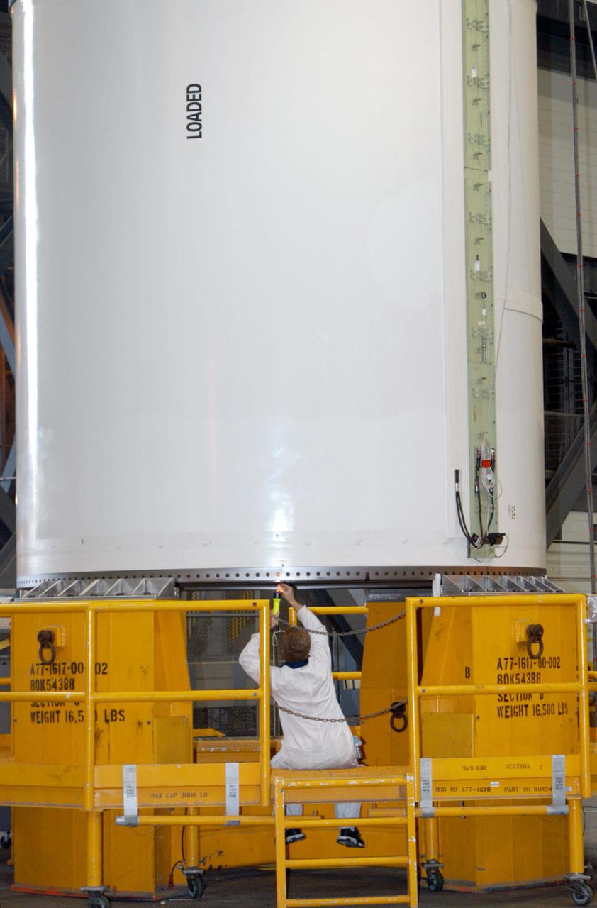 KENNEDY SPACE CENTER, FLA.  -  In the Vehicle Assembly Building at NASA’s Kennedy Space Center, workers are inspecting Solid Rocket Booster segments that will be used to launch Space Shuttle Atlantis on mission STS-121 in July.  STS-121 is a Return to Flight Utilities and Logistics Flight (ULF-2) to the International Space Station.