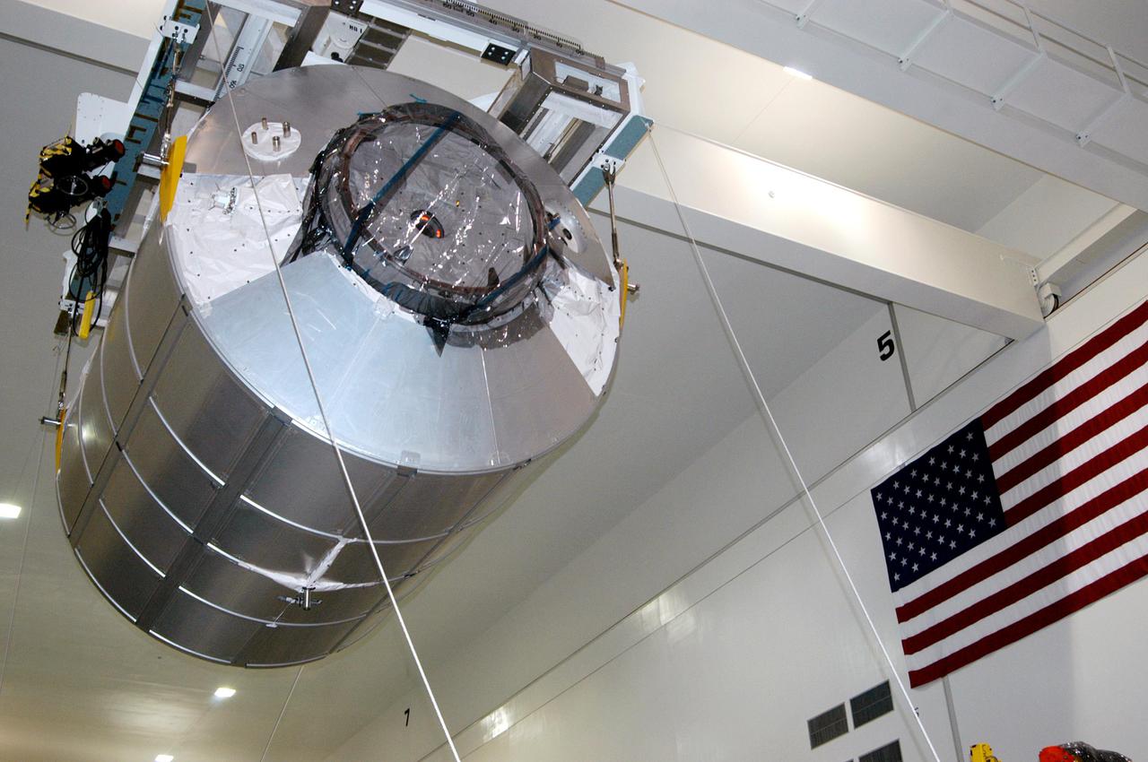 KENNEDY SPACE CENTER, FLA. - In the Space Station Processing Facility, the Multi-Purpose Logistics Module Raffaello moves across the floor to the Payload Transportation Canister for installation and transfer to Launch Pad 39-B.   Raffaello will travel aboard Space Shuttle Discovery on Return to Flight Mission STS-114 to the International Space Station.  Raffaello will carry 12 racks of cargo to the Station, including food, clothing, spare parts and research equipment.  The Boeing Company,  a KSC and NASA prime contractor for ISS element processing, prepared Raffaello for flight.  The module was built by the Italian Space Agency for NASA under a cooperative space agreement.