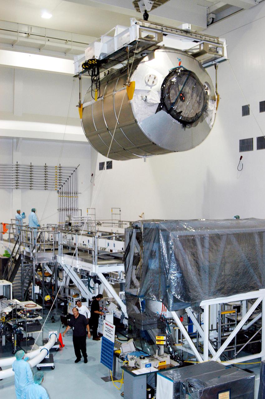 KENNEDY SPACE CENTER, FLA. - In the Space Station Processing Facility, the Multi-Purpose Logistics Module Raffaello moves across the floor to the Payload Transportation Canister for installation and transfer to Launch Pad 39-B.   Raffaello will travel aboard Space Shuttle Discovery on Return to Flight Mission STS-114 to the International Space Station.  Raffaello will carry 12 racks of cargo to the Station, including food, clothing, spare parts and research equipment.  The Boeing Company,  a KSC and NASA prime contractor for ISS element processing, prepared Raffaello for flight.  The module was built by the Italian Space Agency for NASA under a cooperative space agreement.